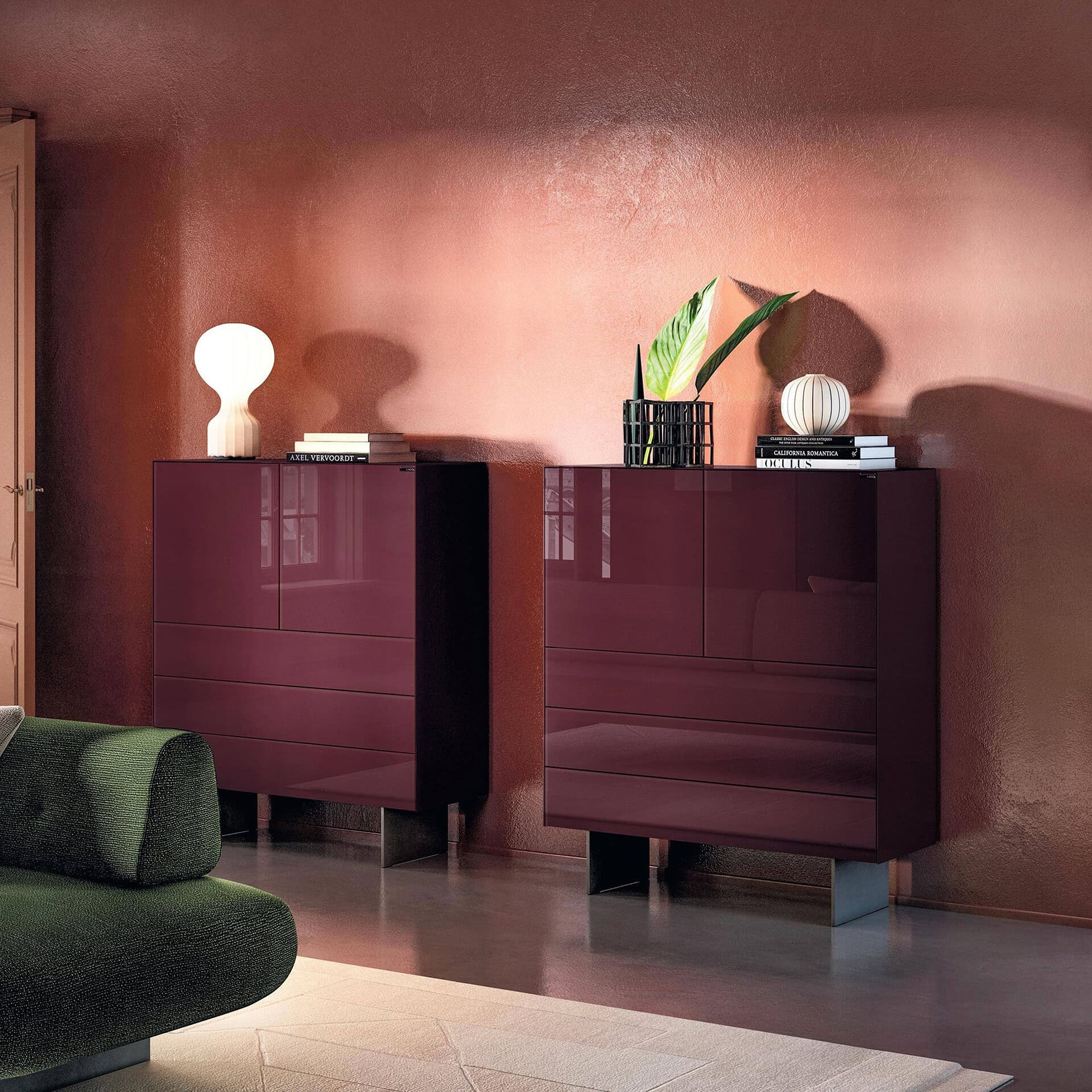 Maroon storage cabinets with decorative accessories in a modern living room.
