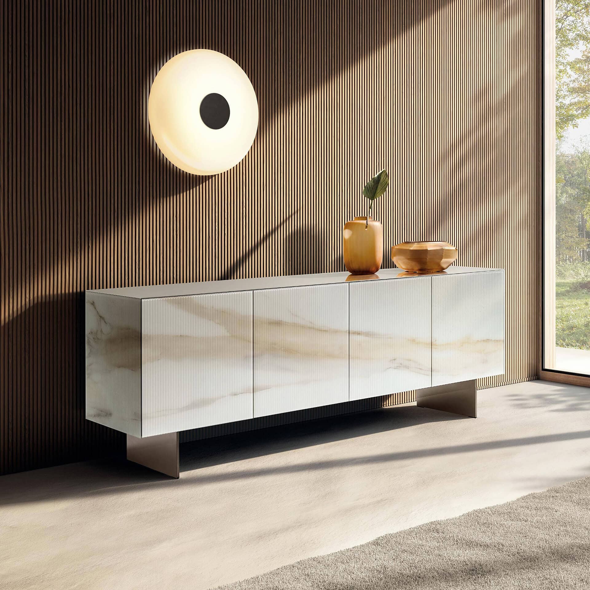 Modern marble sideboard with decorative vases and a wall-mounted light.