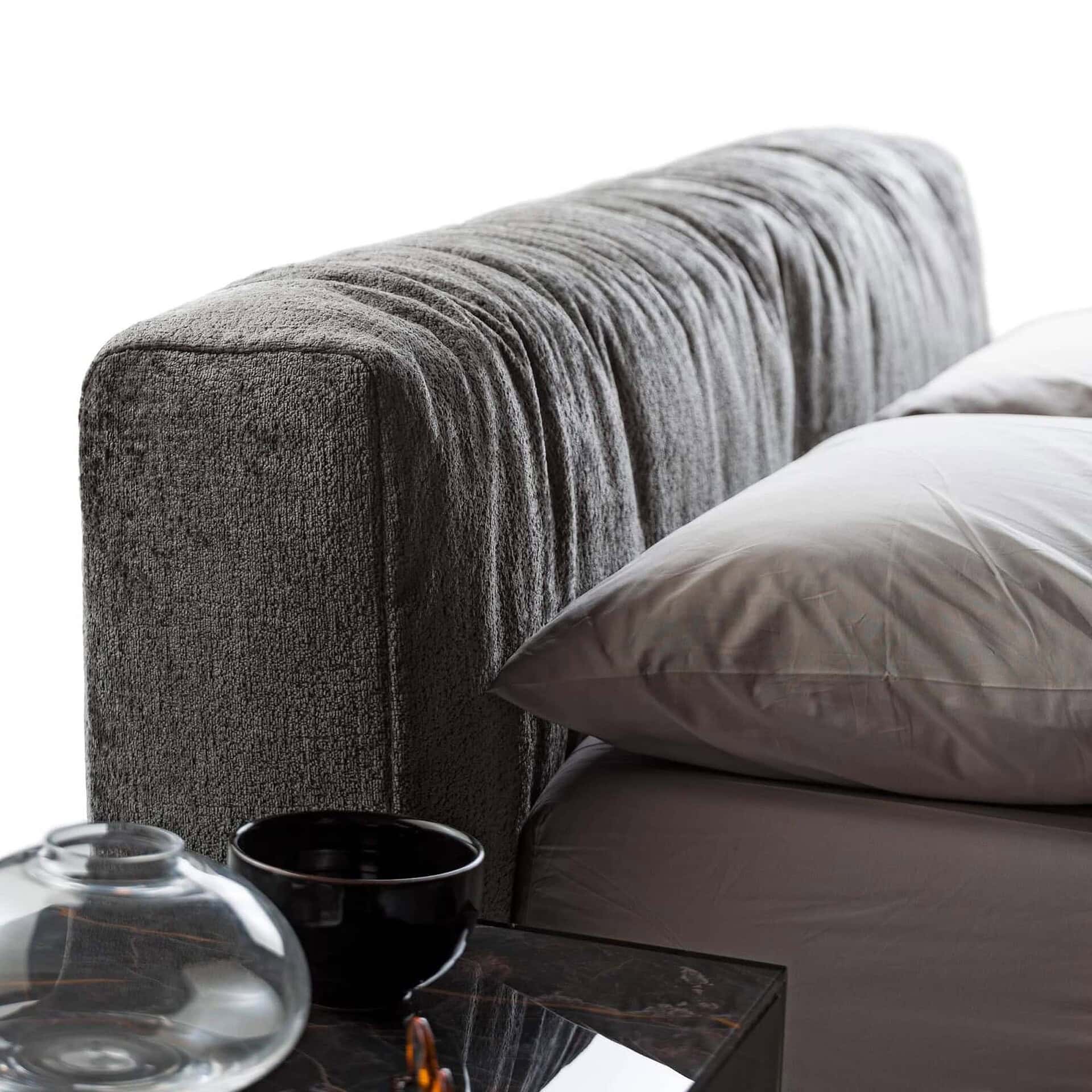 Close-up of Steel Soft Bed upholstered headboard in textured fabric