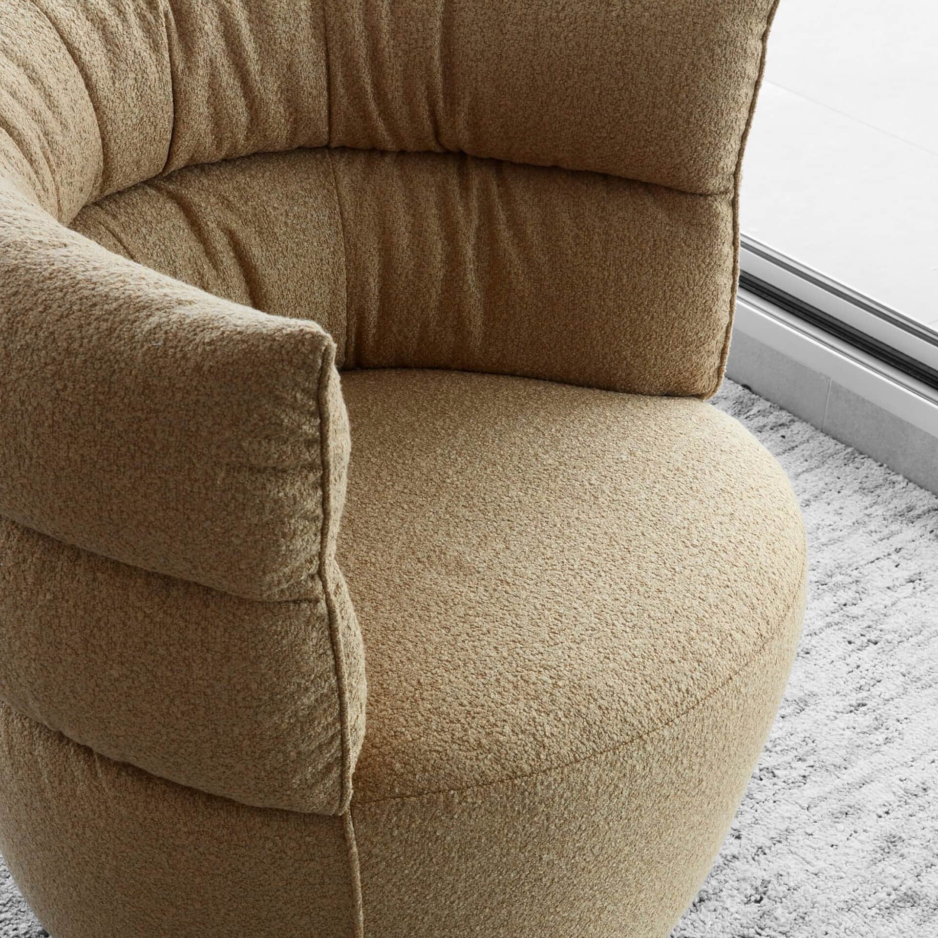 Armchair with plush beige fabric, perfect for cozy living room seating.