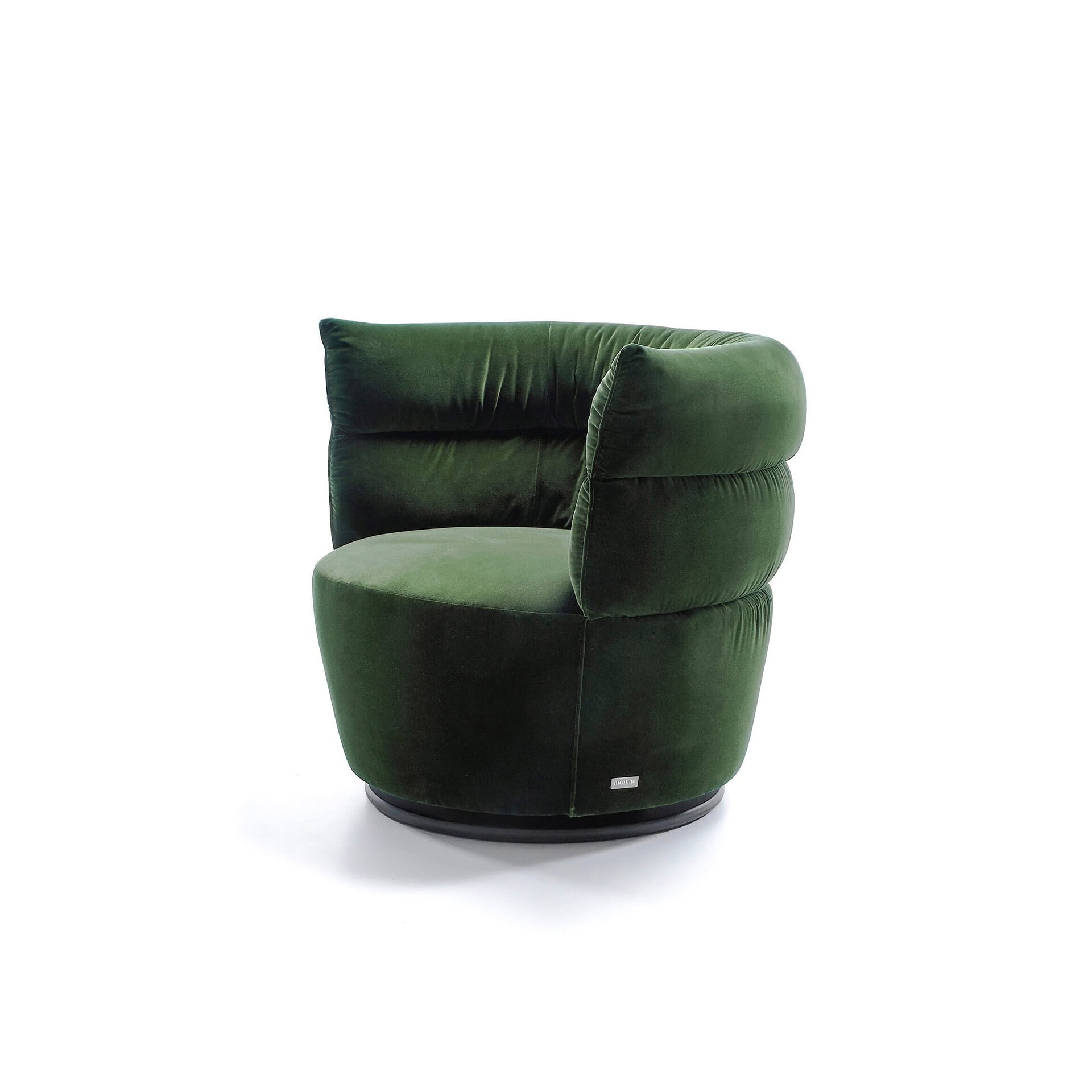Green velvet lounge chair with plush cushioning and rounded modern design.