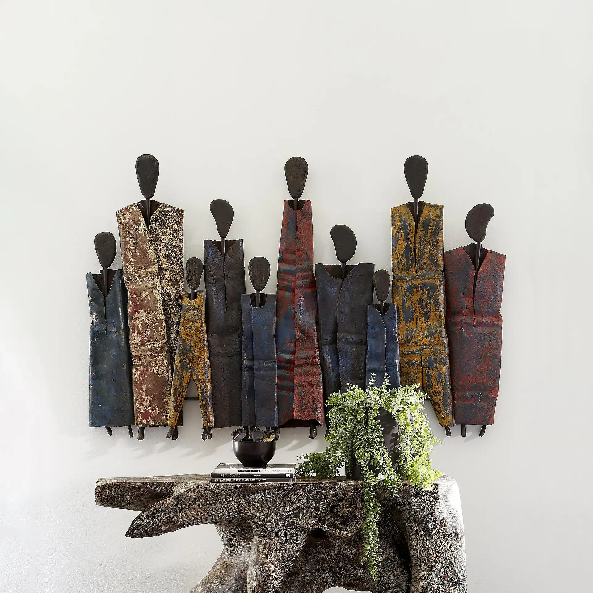 Unique metal wall sculptures with abstract human figures for modern home decor.