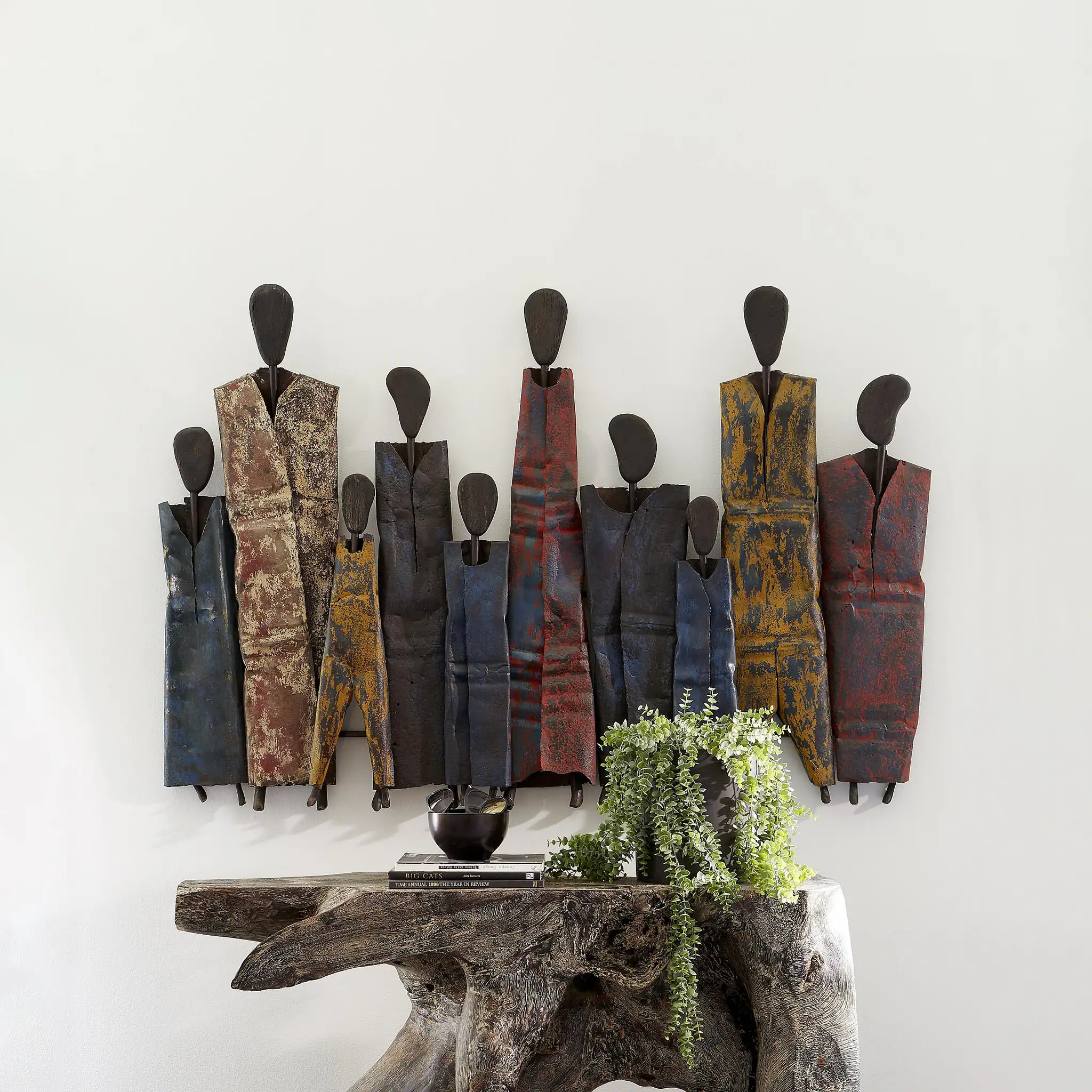 Unique metal wall sculptures with abstract human figures for modern home decor.
