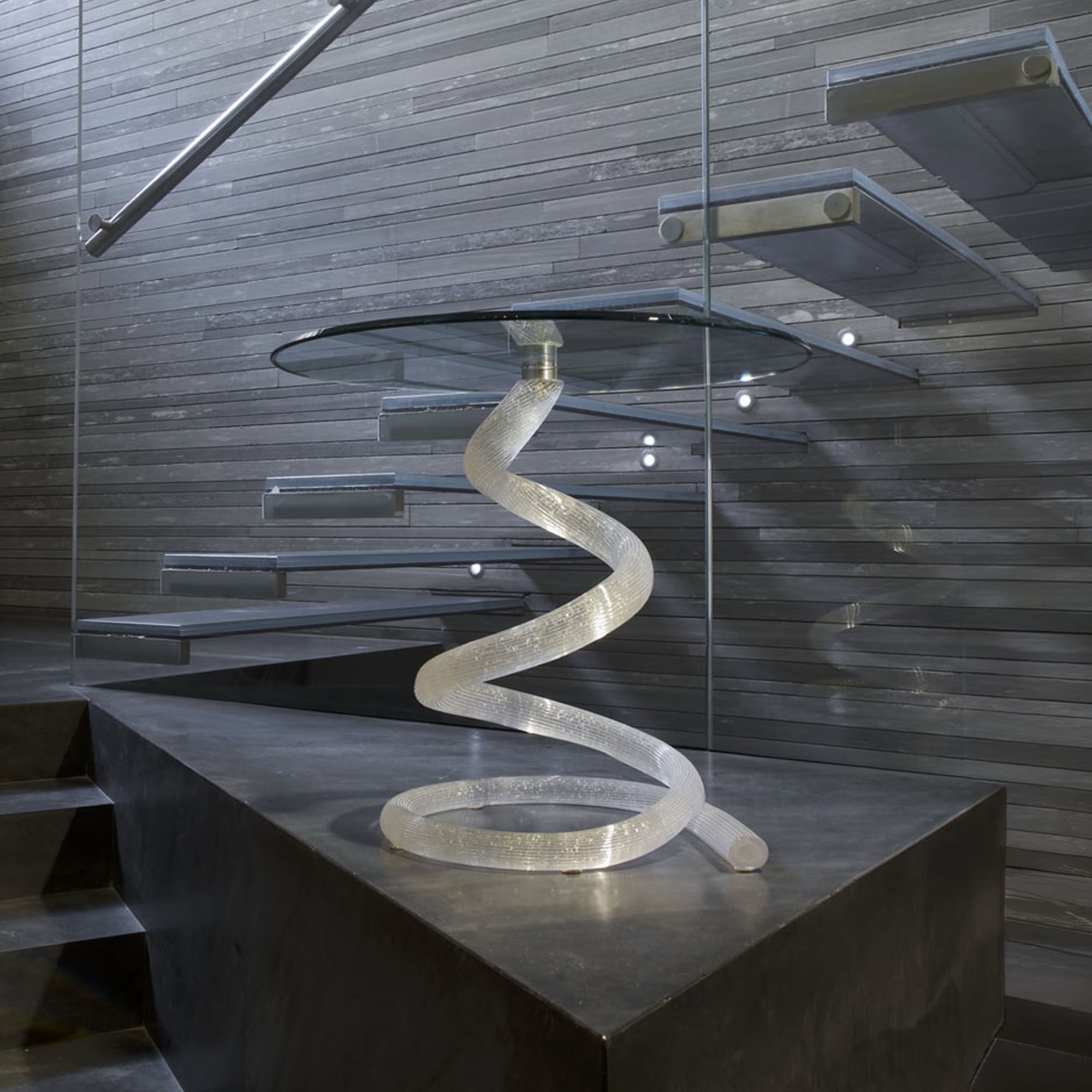 Sculptural Ghibli 55 side table with a spiral glass base and round glass top, modern design for styl.