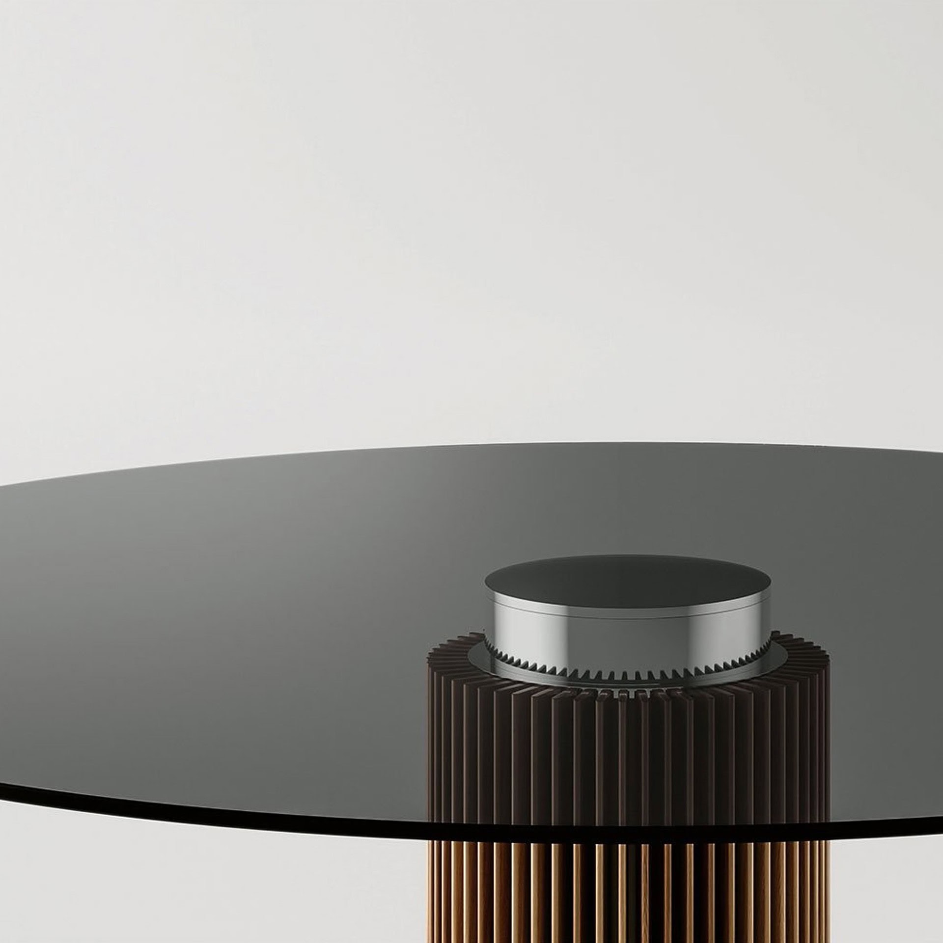 a round glass table with a silver top