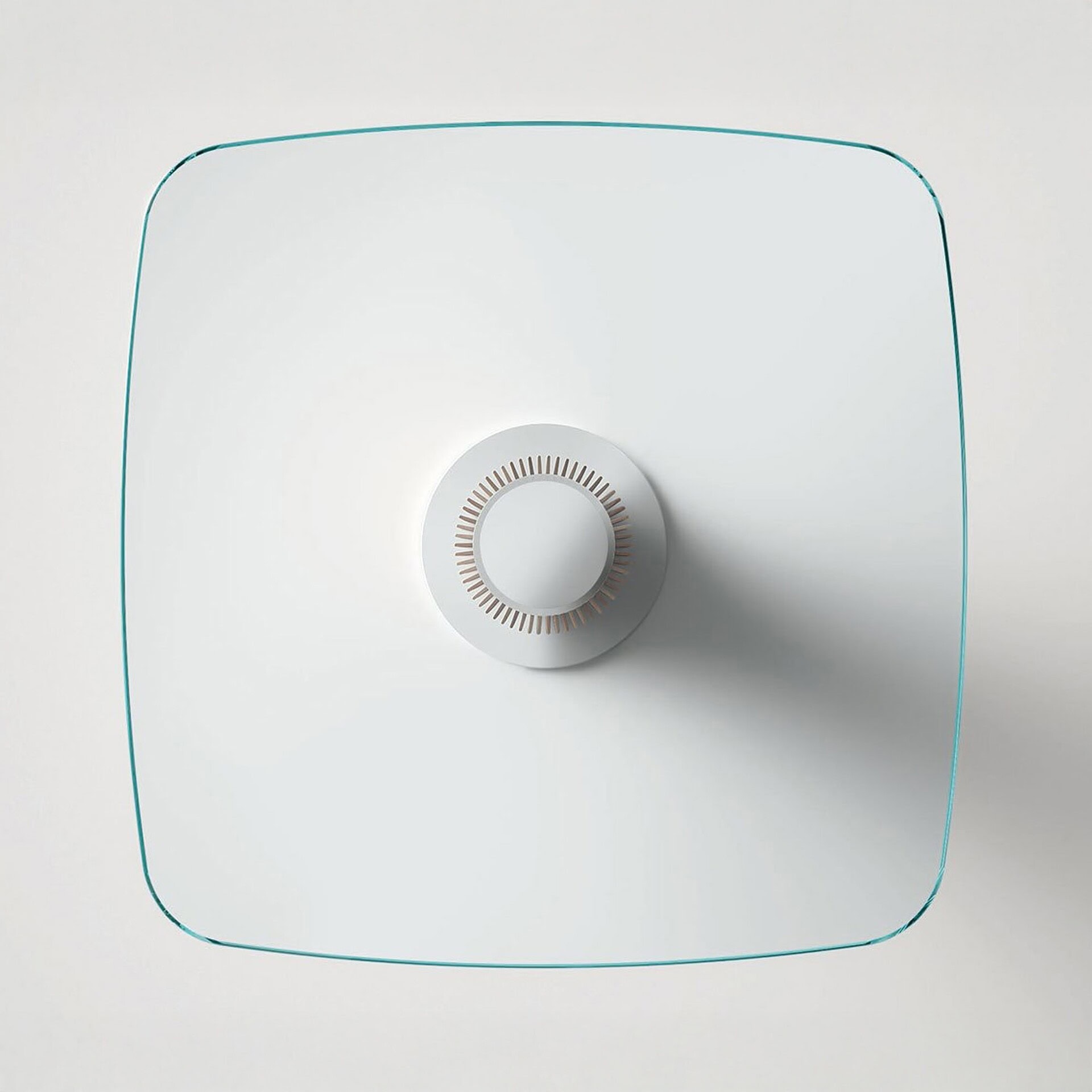 a white square object with a circular object in the middle