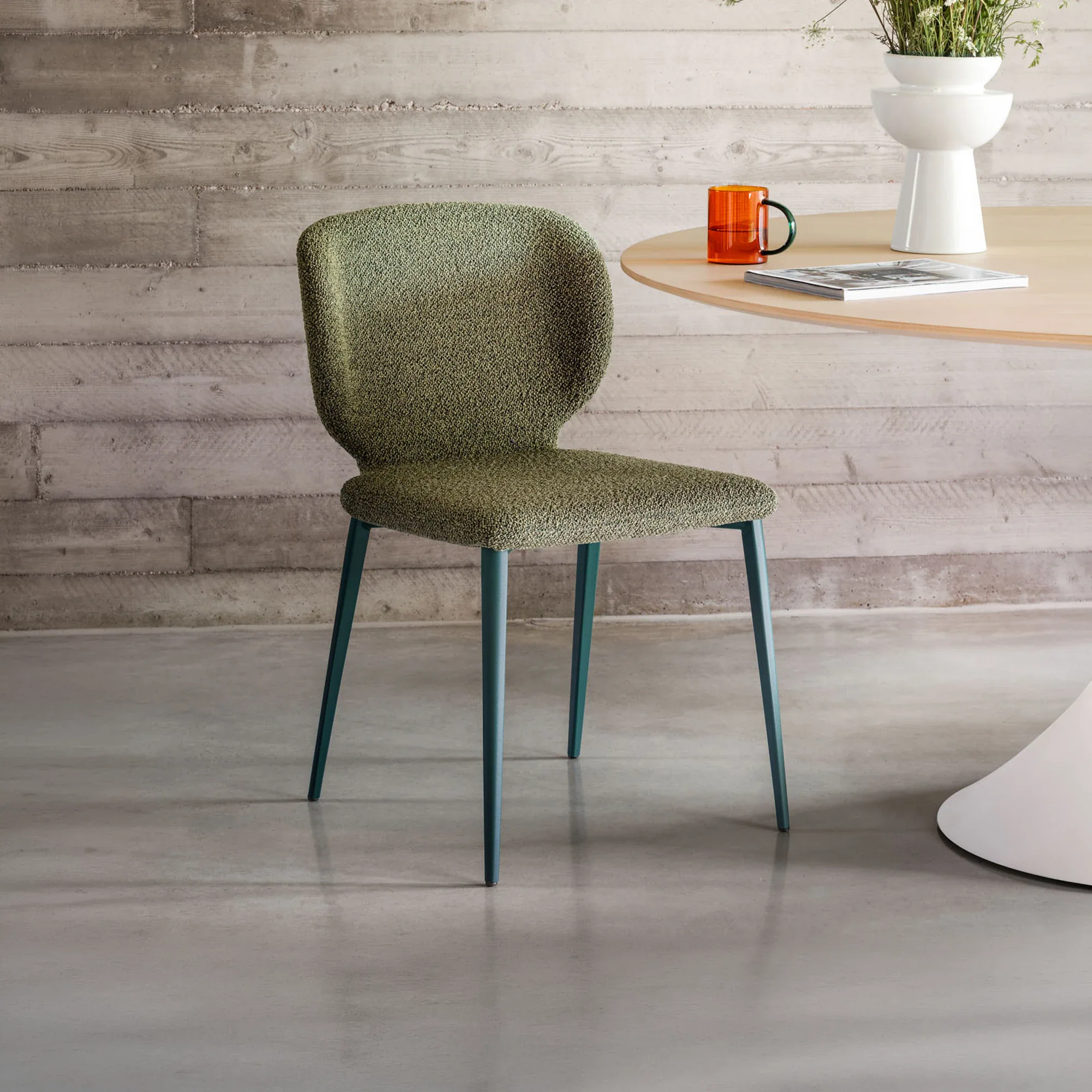 Upholstered dining chair with modern design, perfect for contemporary kitchens and dining rooms.