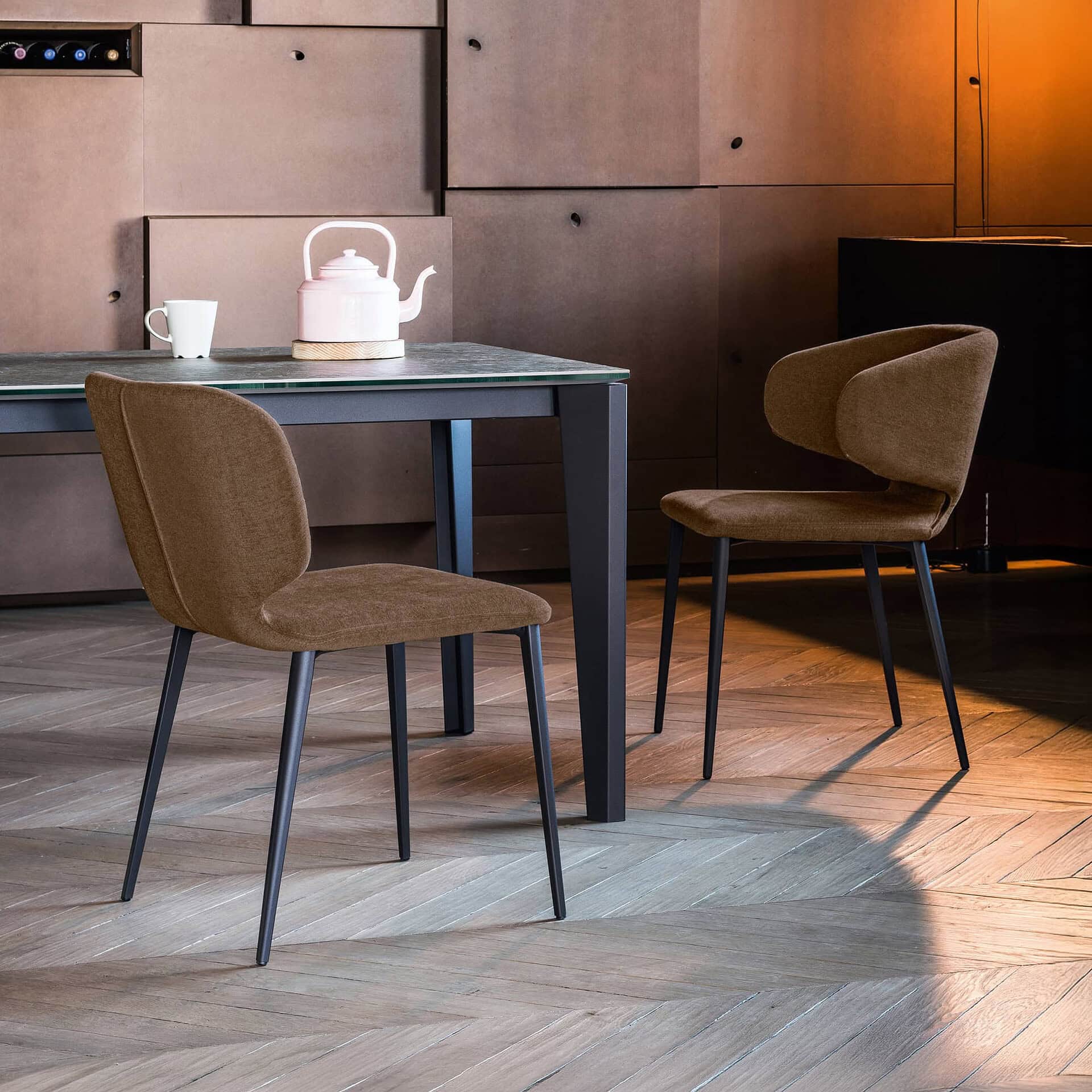 Upholstered dining chair with modern design, perfect for contemporary kitchens and dining rooms.