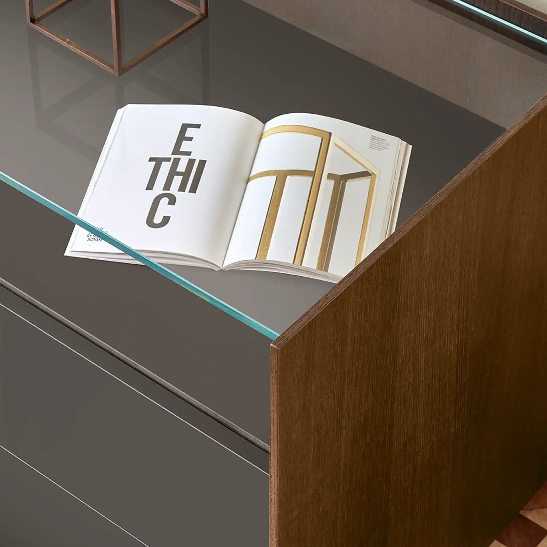 Elegant furniture display table with a catalog highlighting contemporary furniture styles.