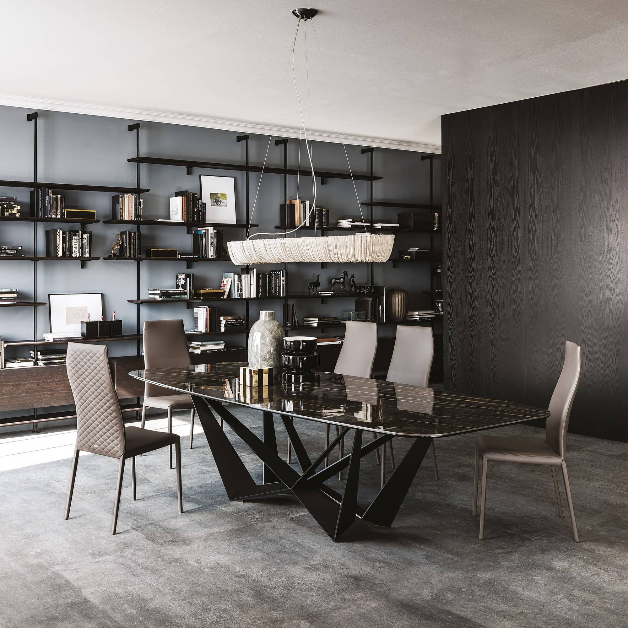 Close-up of Skorpio Keramik dining table with dramatic dark marble ceramic finish.