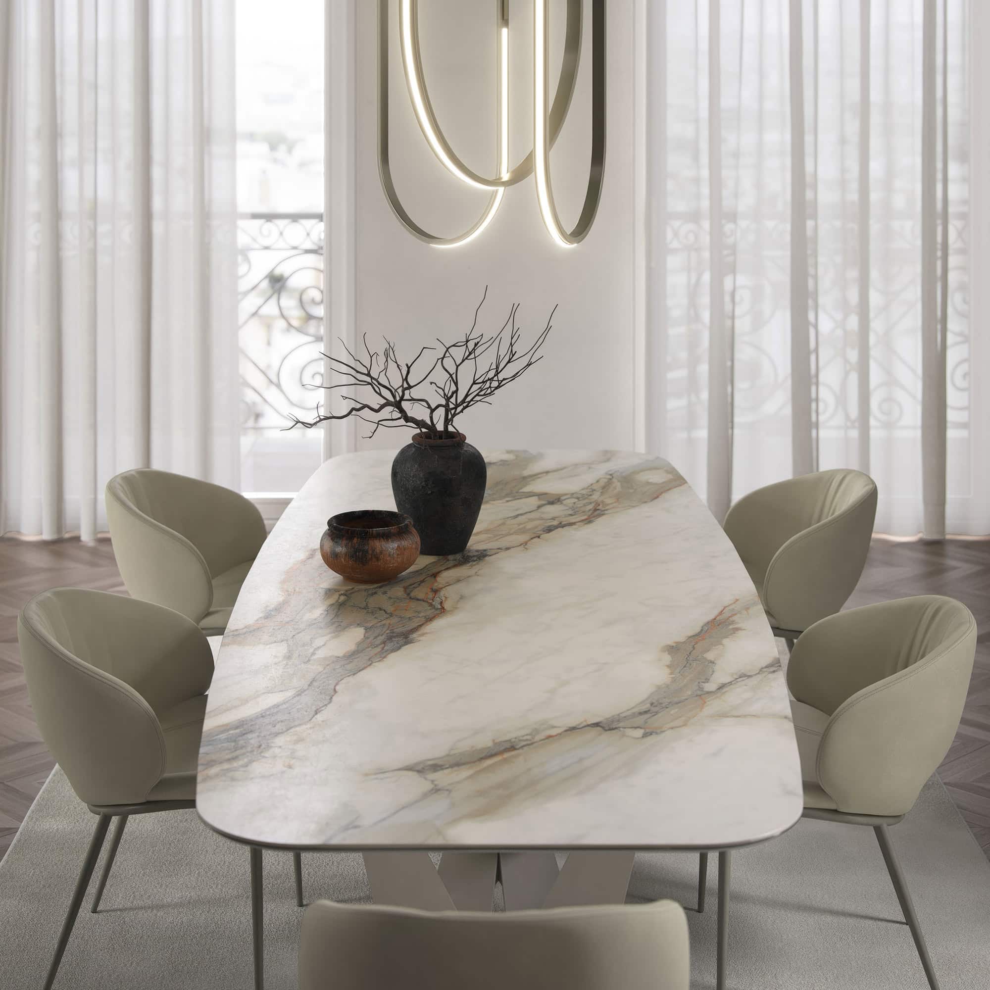 Round version of the Skorpio Keramik dining table with a marble ceramic top.