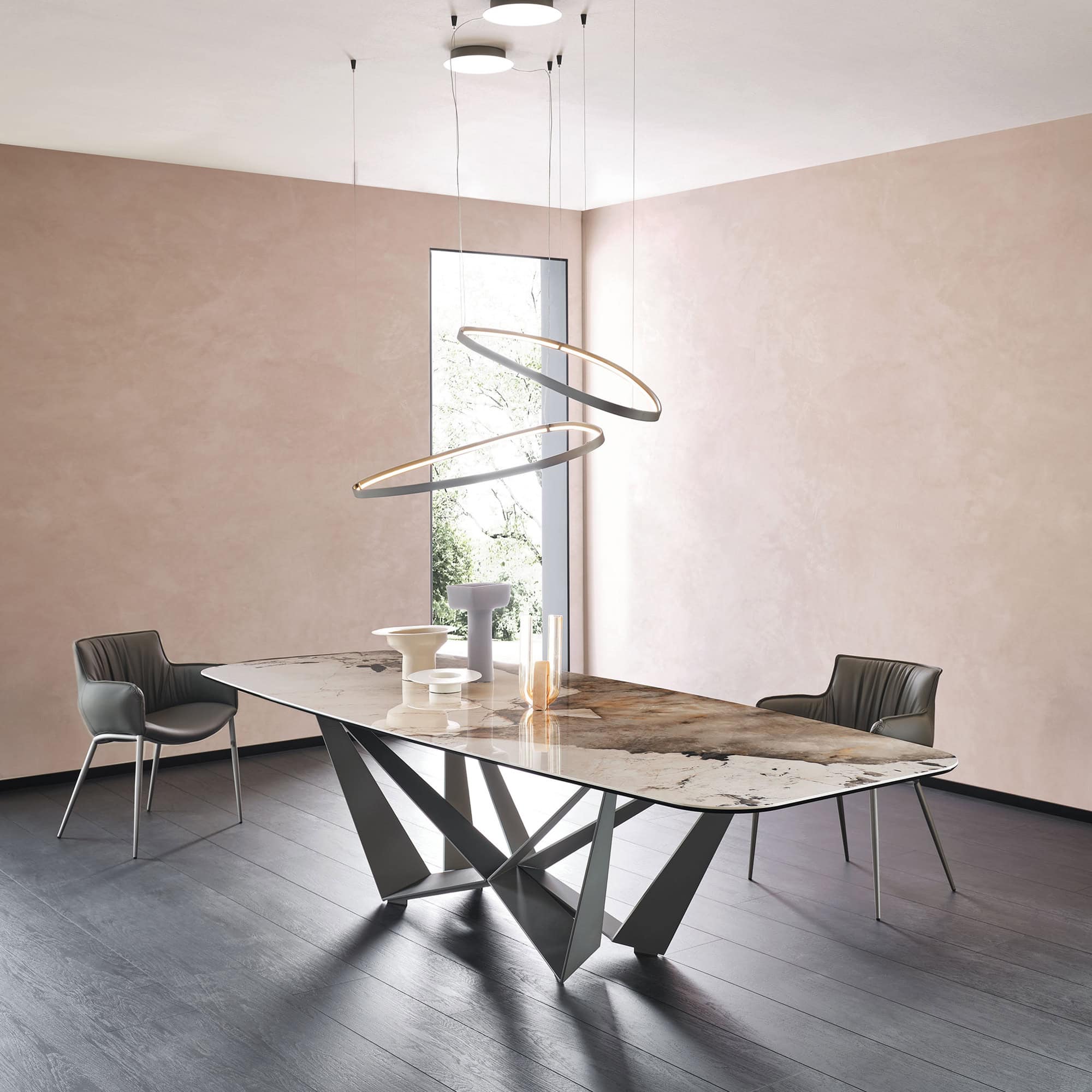 Large Skorpio Keramik dining table with white marble ceramic top styled with modern chairs.