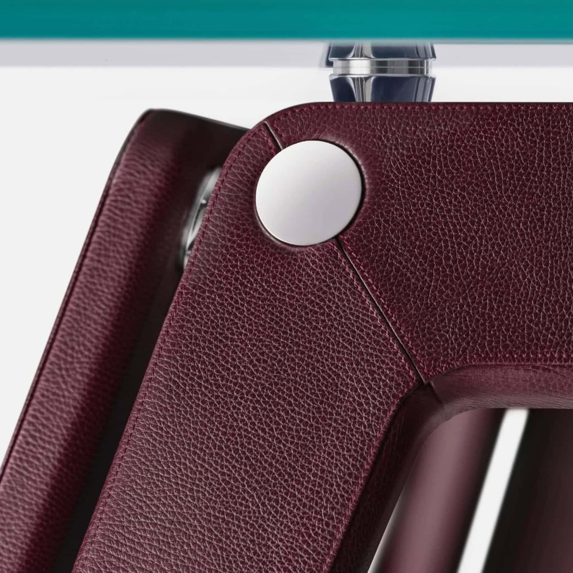 Modern red leather dining chair emphasizing high-quality craftsmanship.