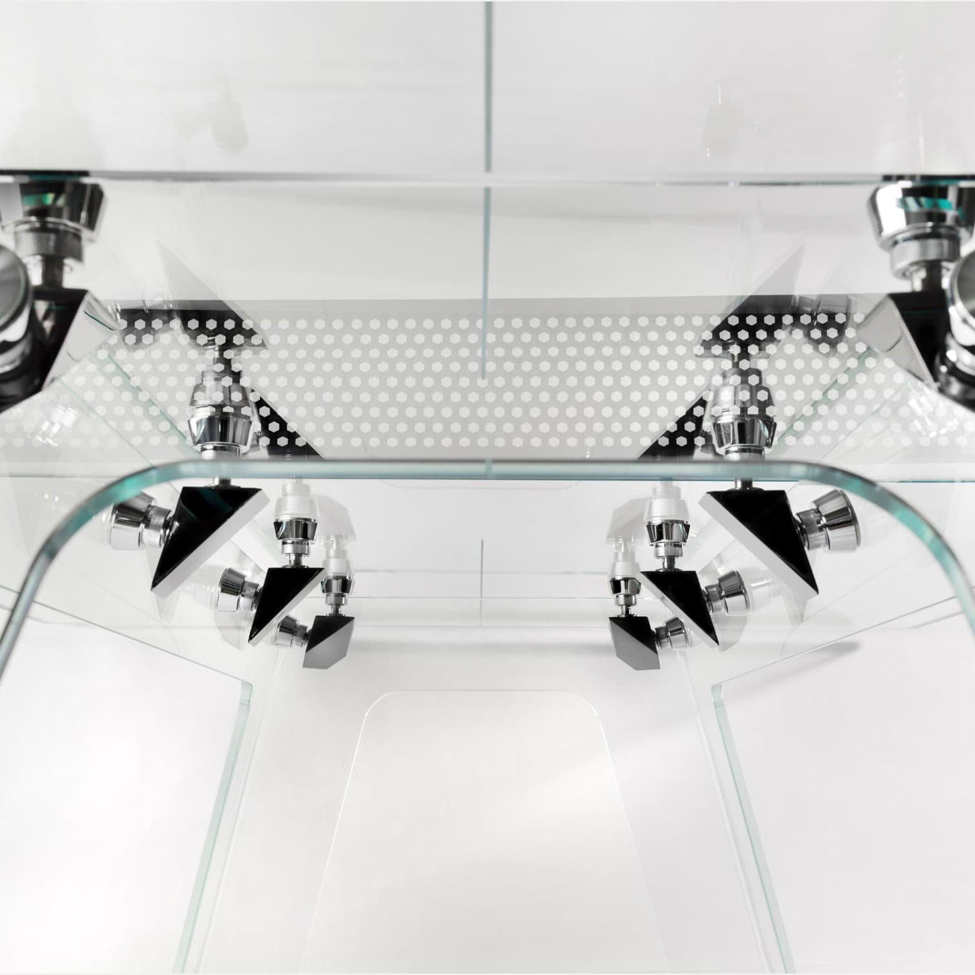 a glass shower with chrome fixtures