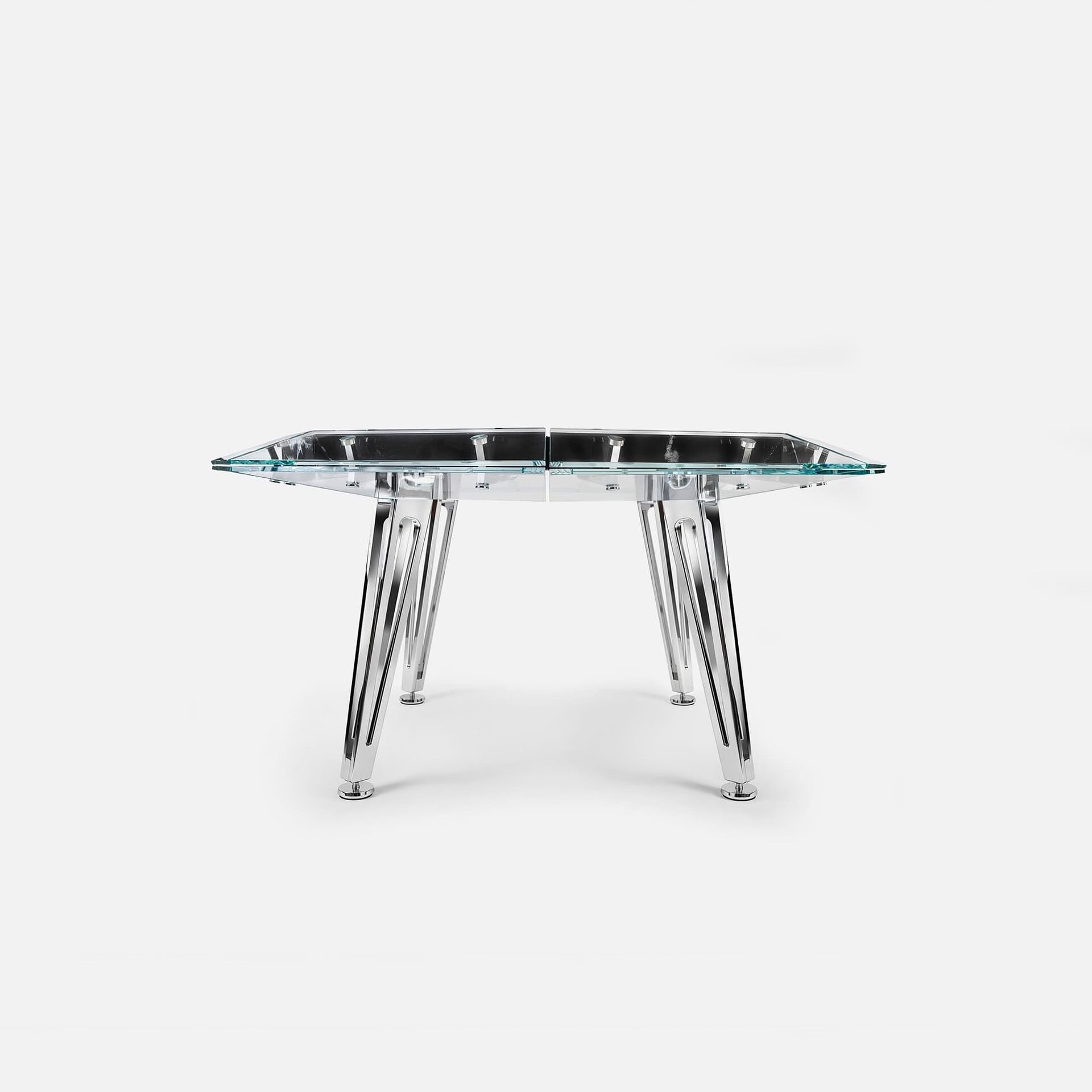 Sleek modern glass dining table with chrome legs, stylish and durable furniture design.