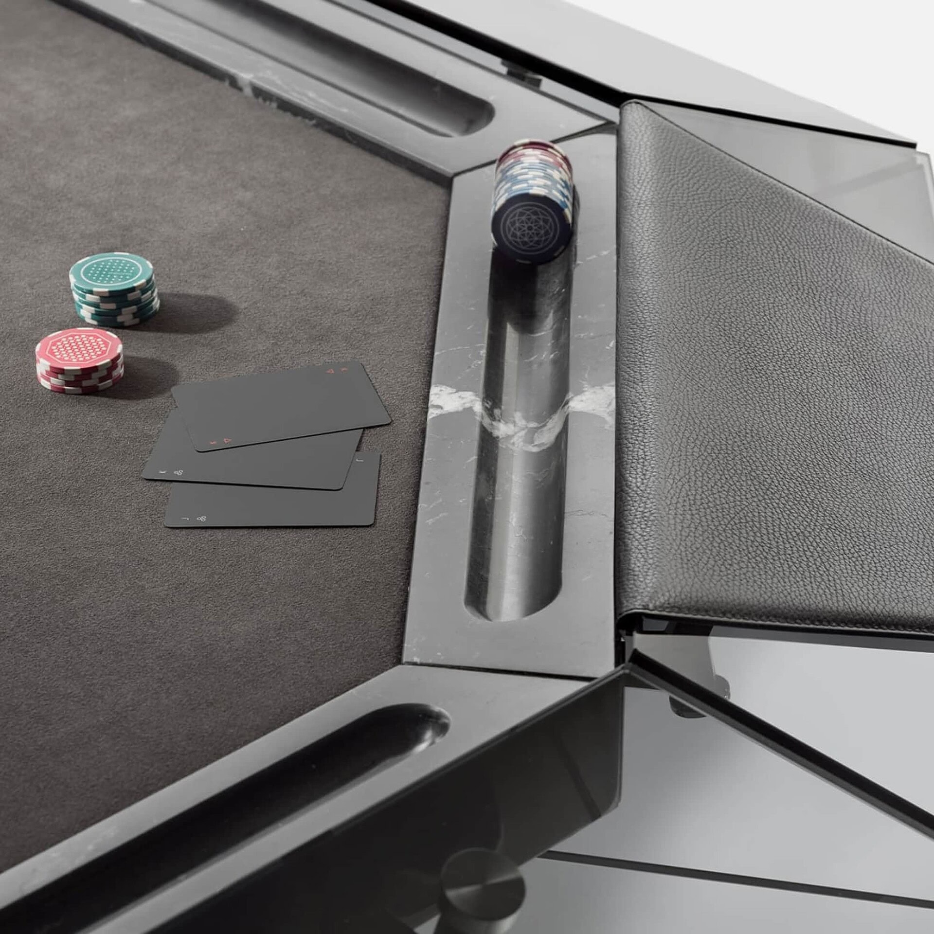 Elegant poker table with chips and cards, perfect for high-end casino gaming experiences.