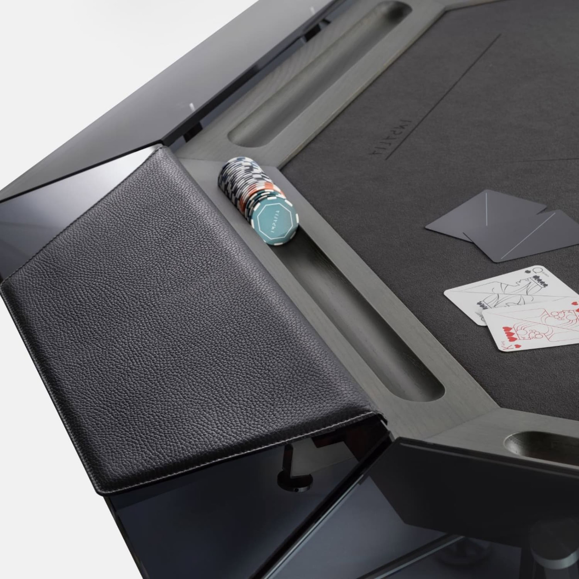 1. Modern game table with built-in card shuffler and sleek black leather bench.