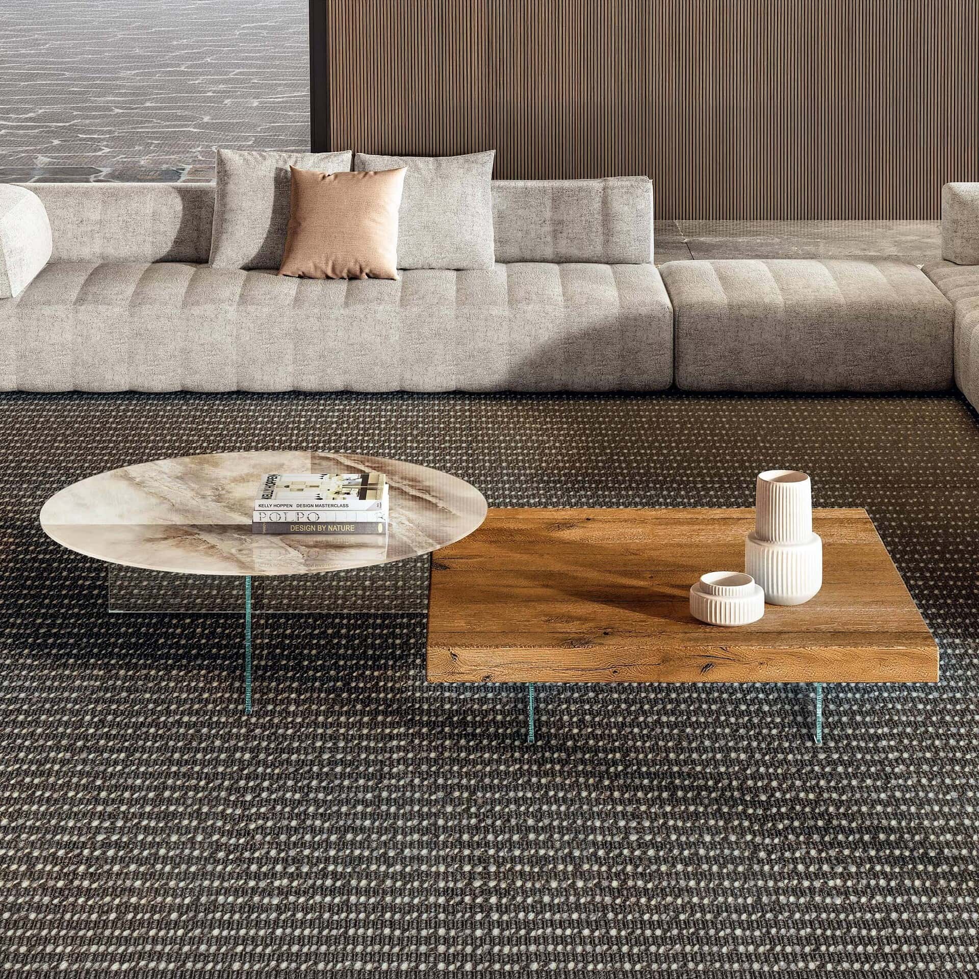 Modern air floating coffee table with marble and wood surfaces in stylish living room.