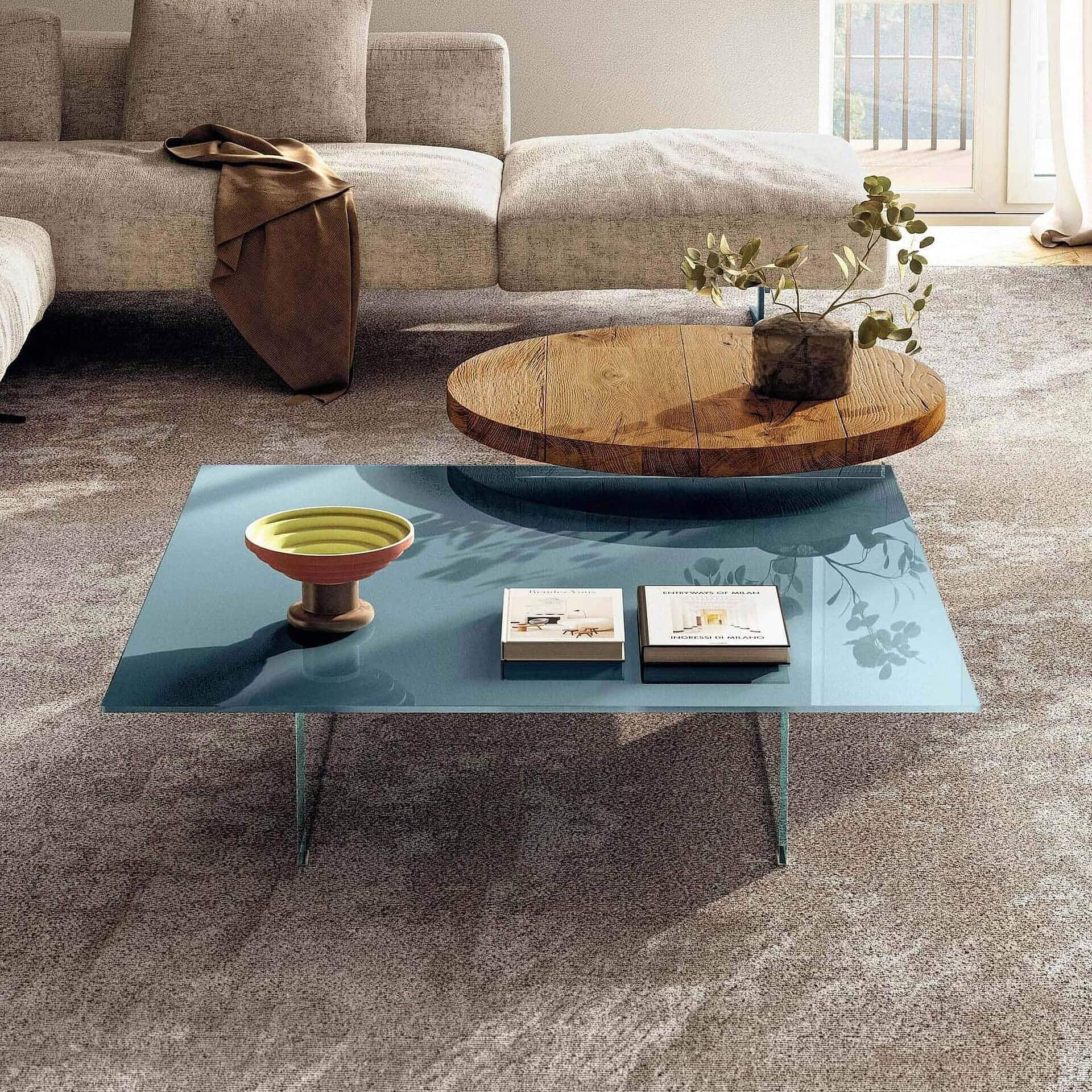 Modern air floating coffee table with a sleek blue glass top and minimalist design.