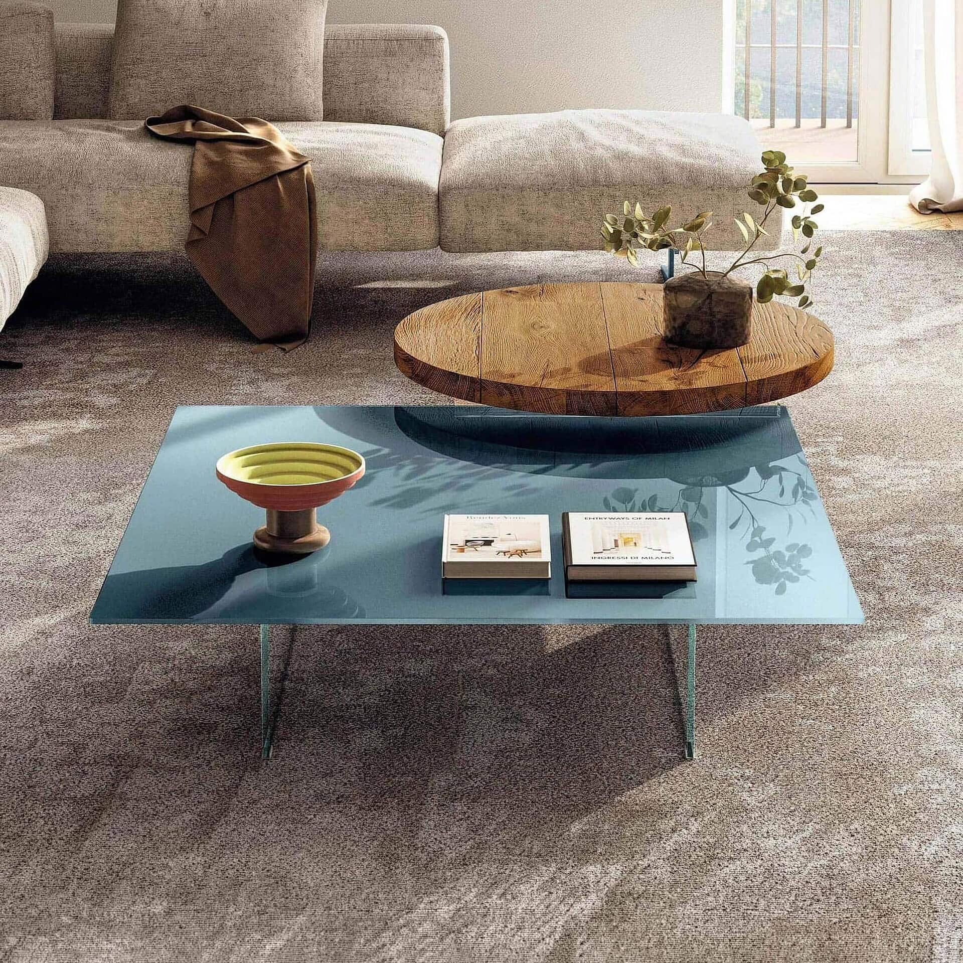 Modern air floating coffee table with a sleek blue glass top and minimalist design.