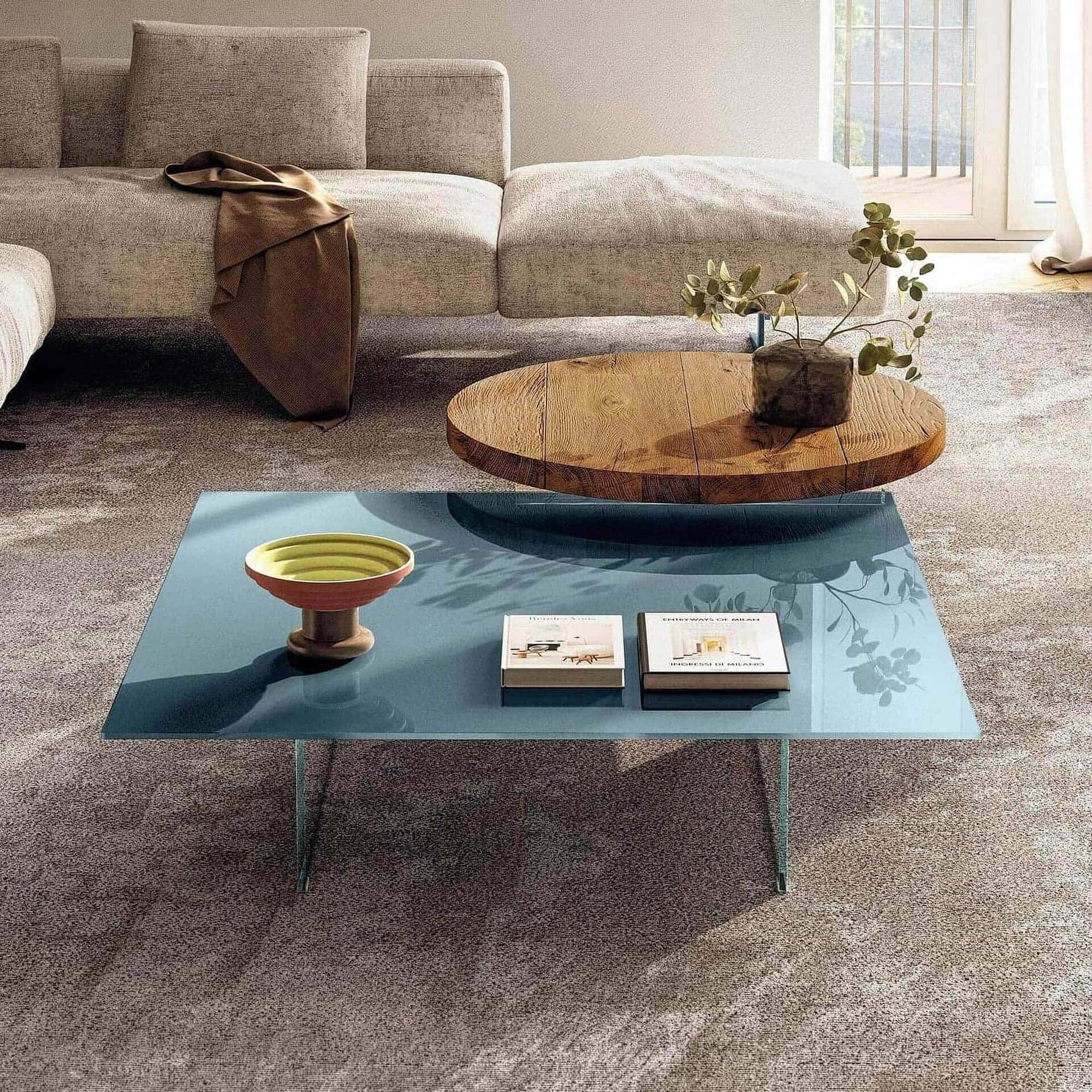 Modern air floating coffee table with a sleek blue glass top and minimalist design.