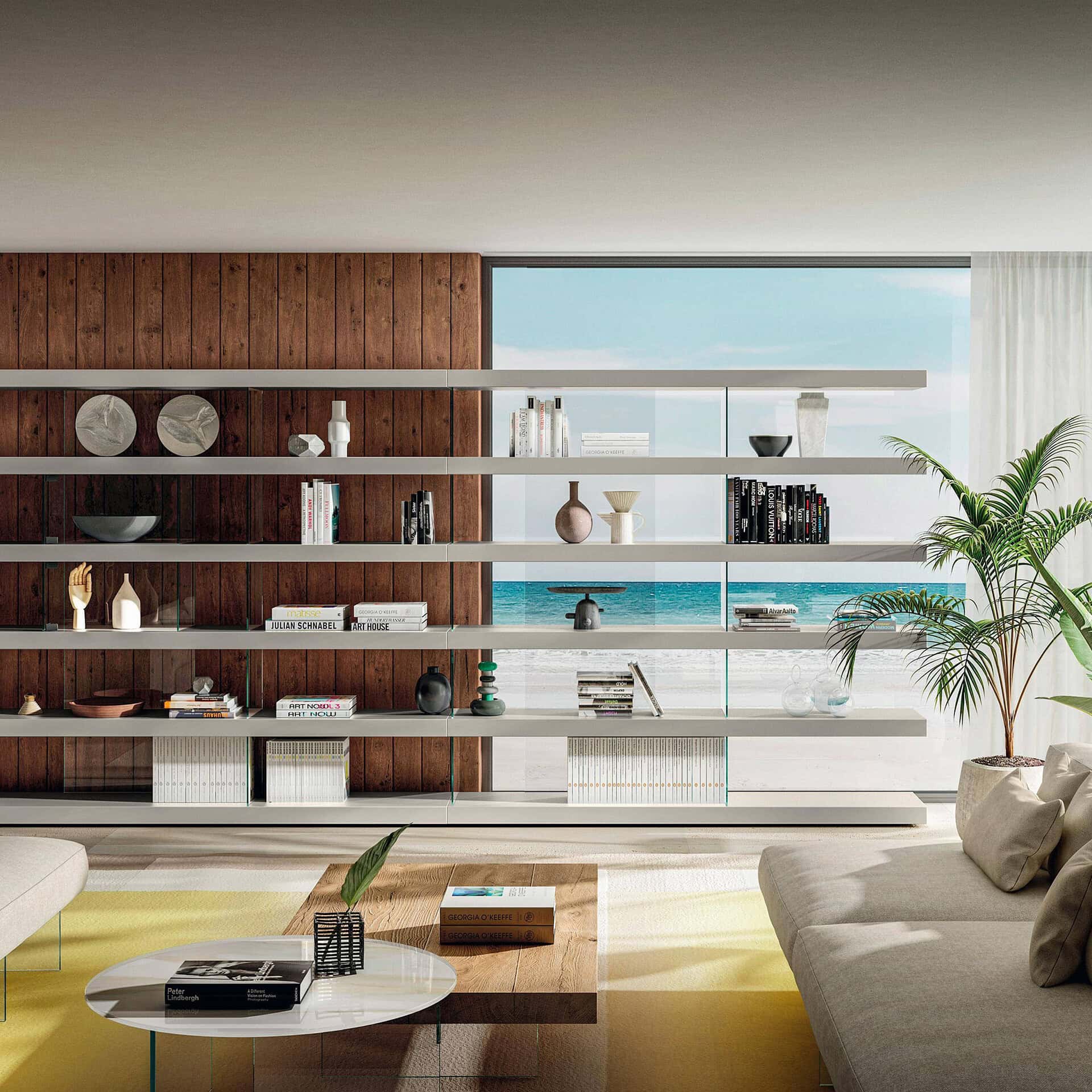 Modern living room with sleek white shelves and ocean view backdrop.
