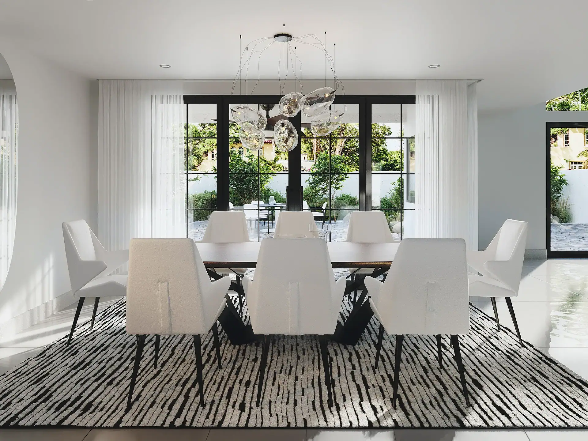 Modern white dining room with large windows, stylish chandelier, and contemporary furniture.