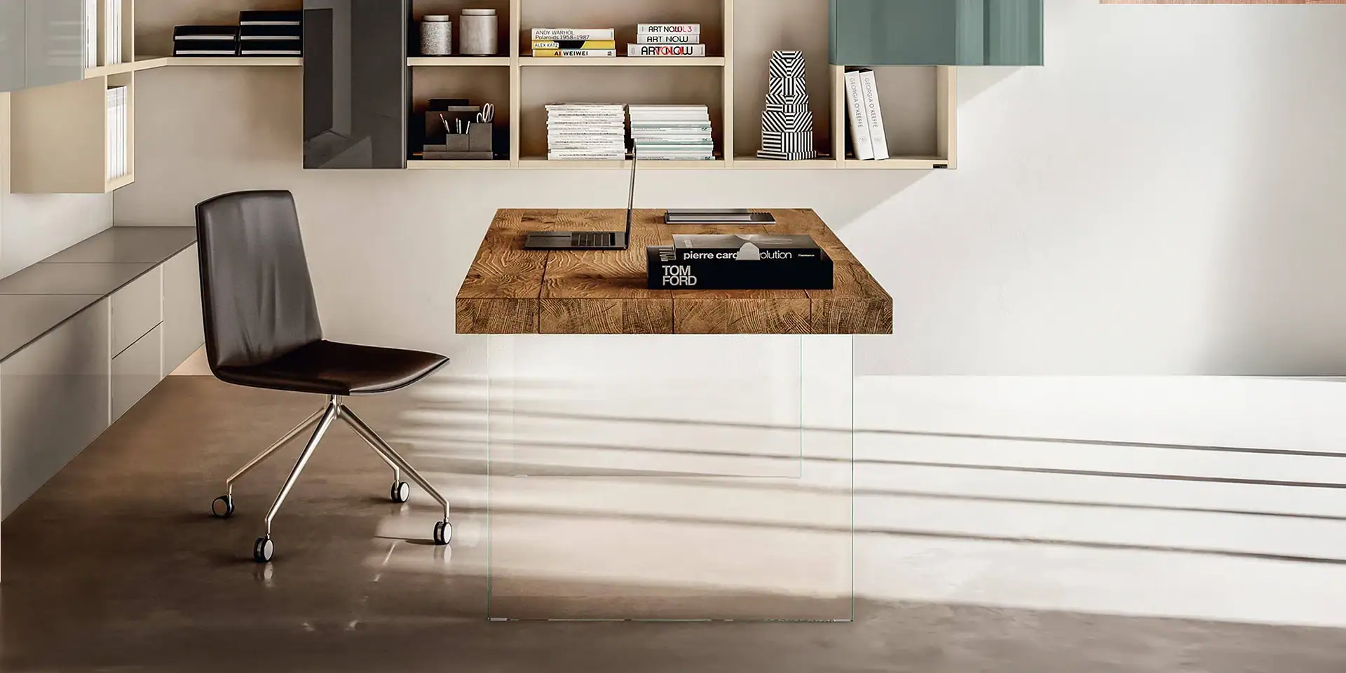 Contemporary office workspace with wooden desk and wall-mounted shelves.