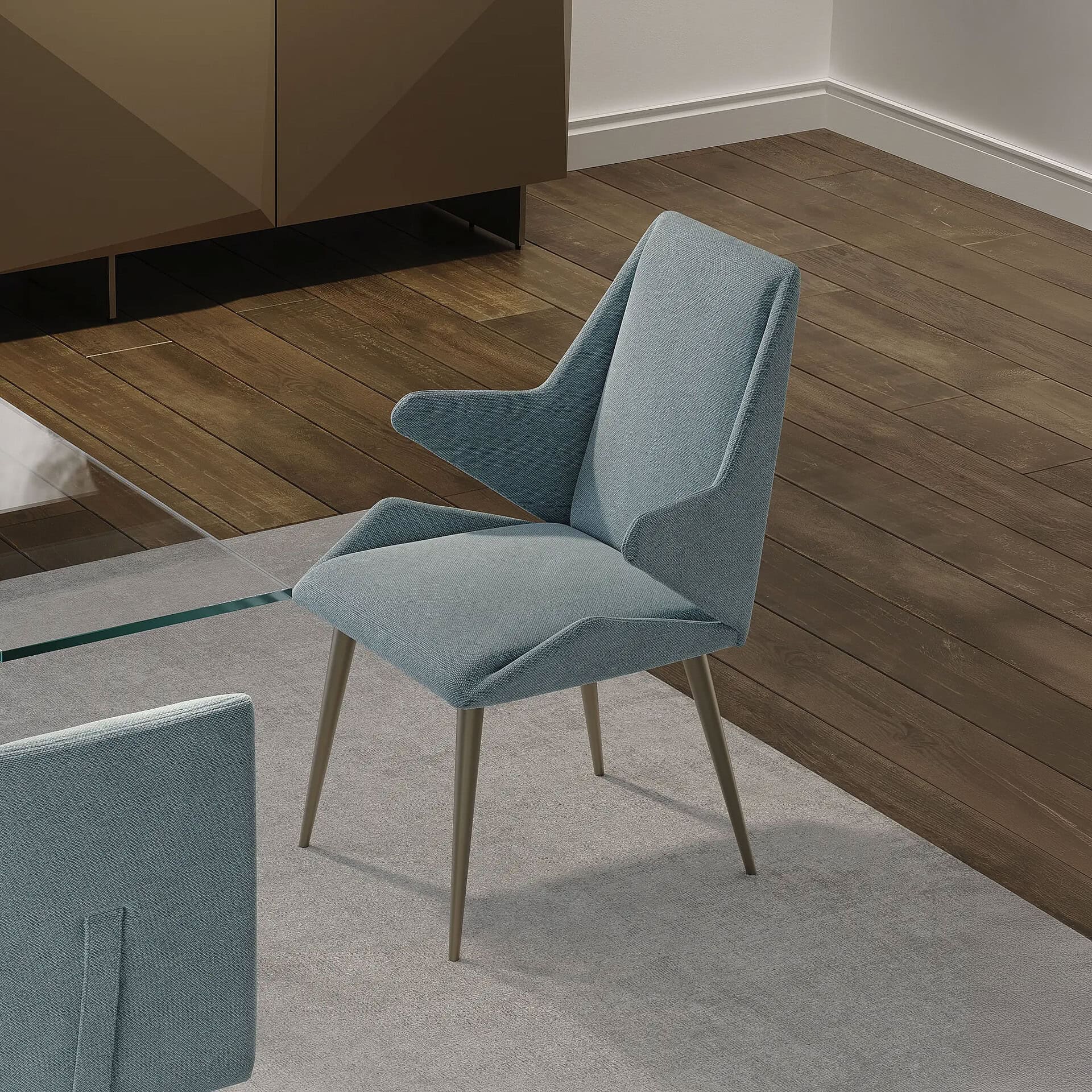 Origami Upholstered Dining Chairs in a modern dining space, upholstered in blue fabric with angled legs.