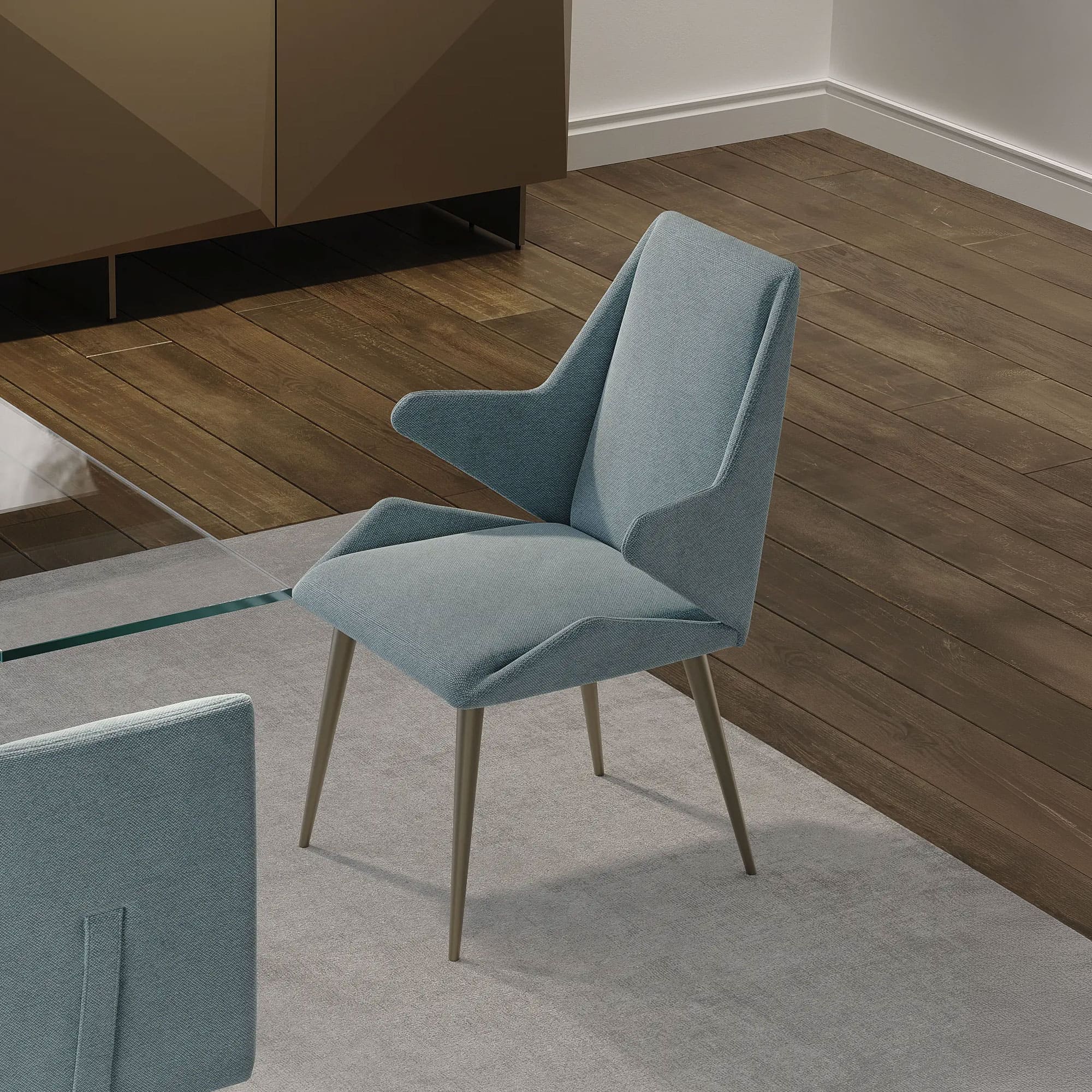 Origami Upholstered Dining Chairs in a modern dining space, upholstered in blue fabric with angled legs.