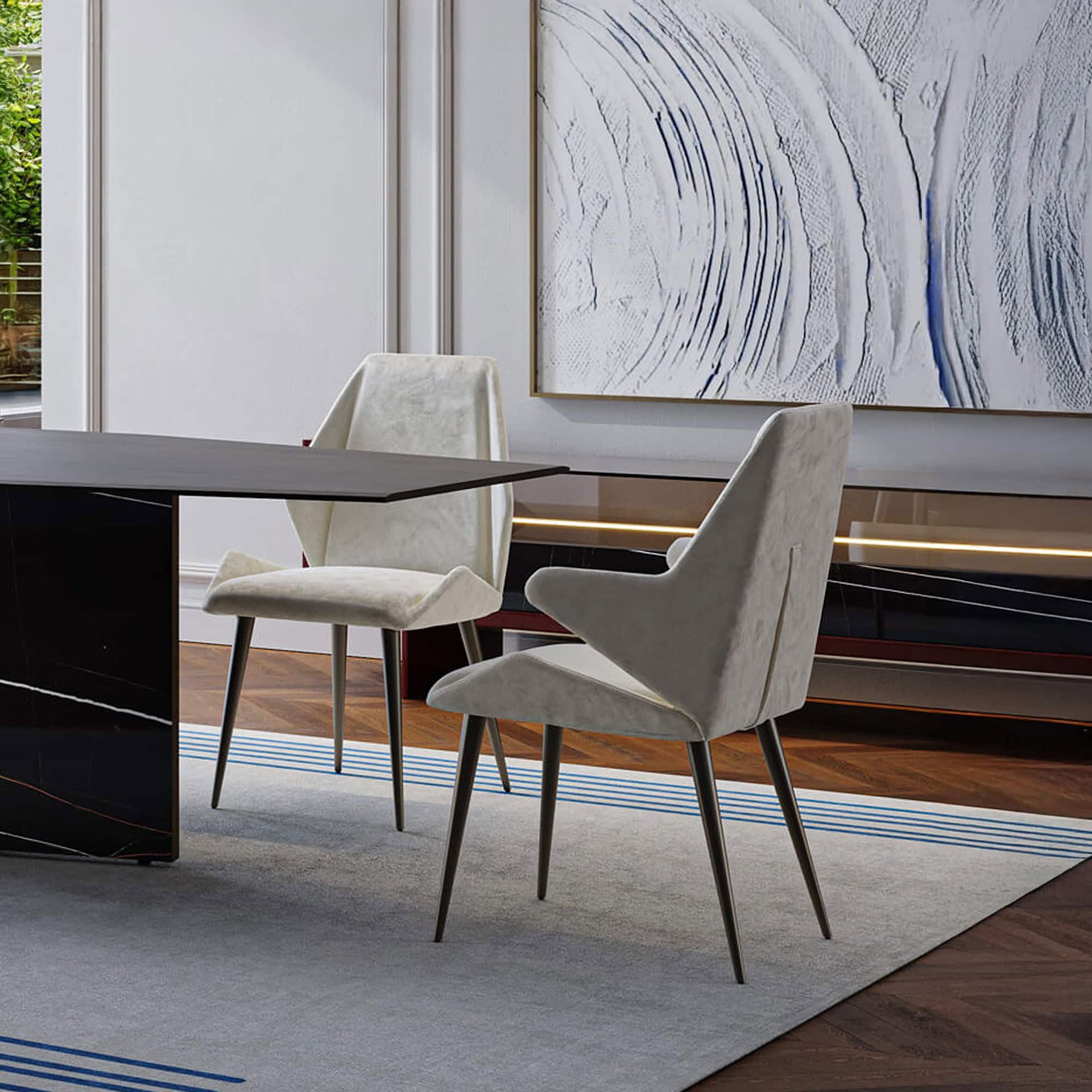 Pair of Origami Upholstered Dining Chairs at a dining table, showcasing their sculptural design and neutral upholstery.