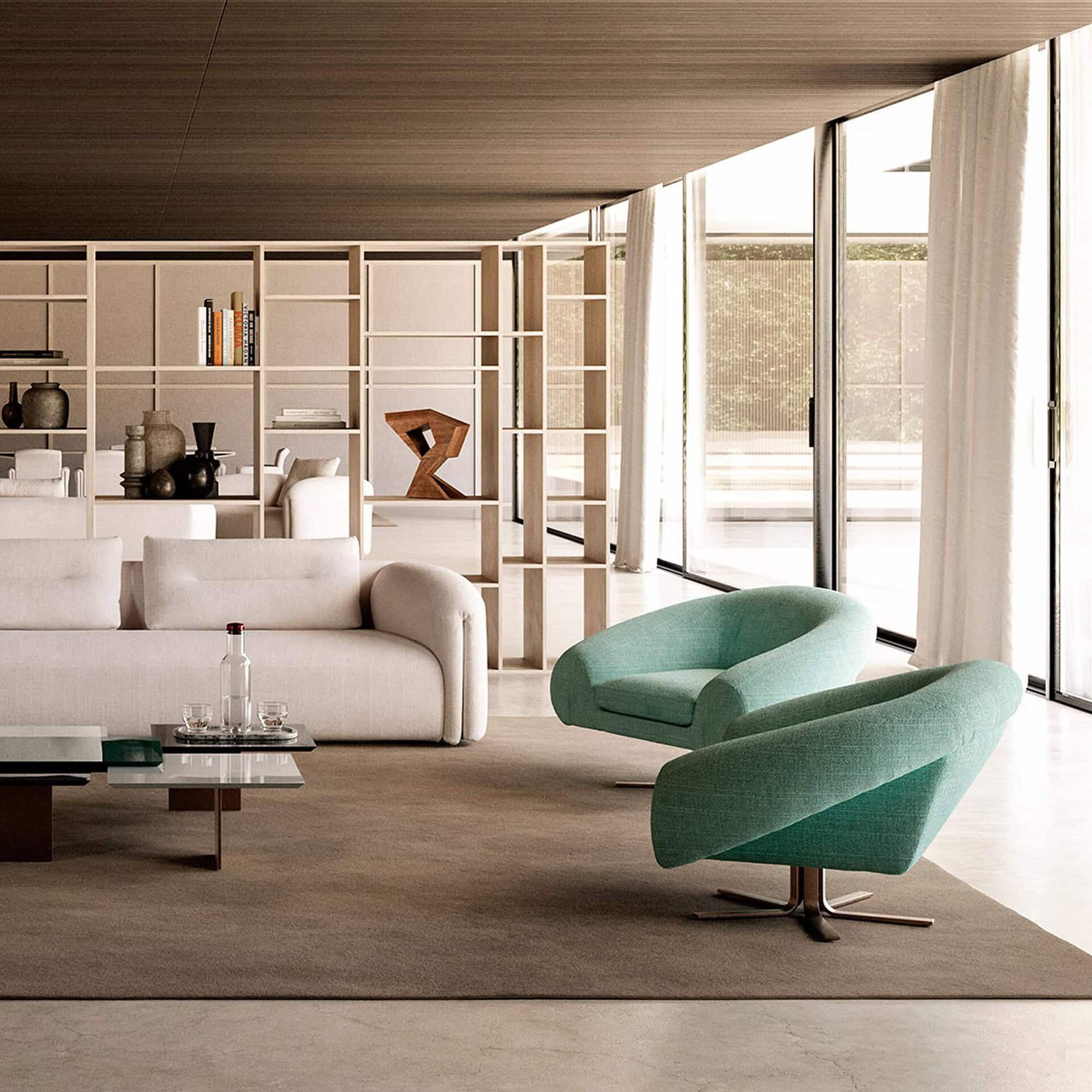 Airstrike Swivel Armchair in green upholstery shown in a modern open living room with floor-to-ceiling windows.