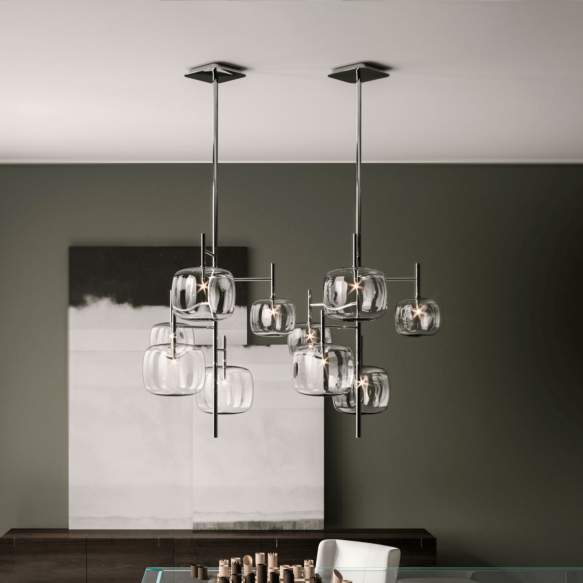 Pendant chandelier with glass globes and metal accents.