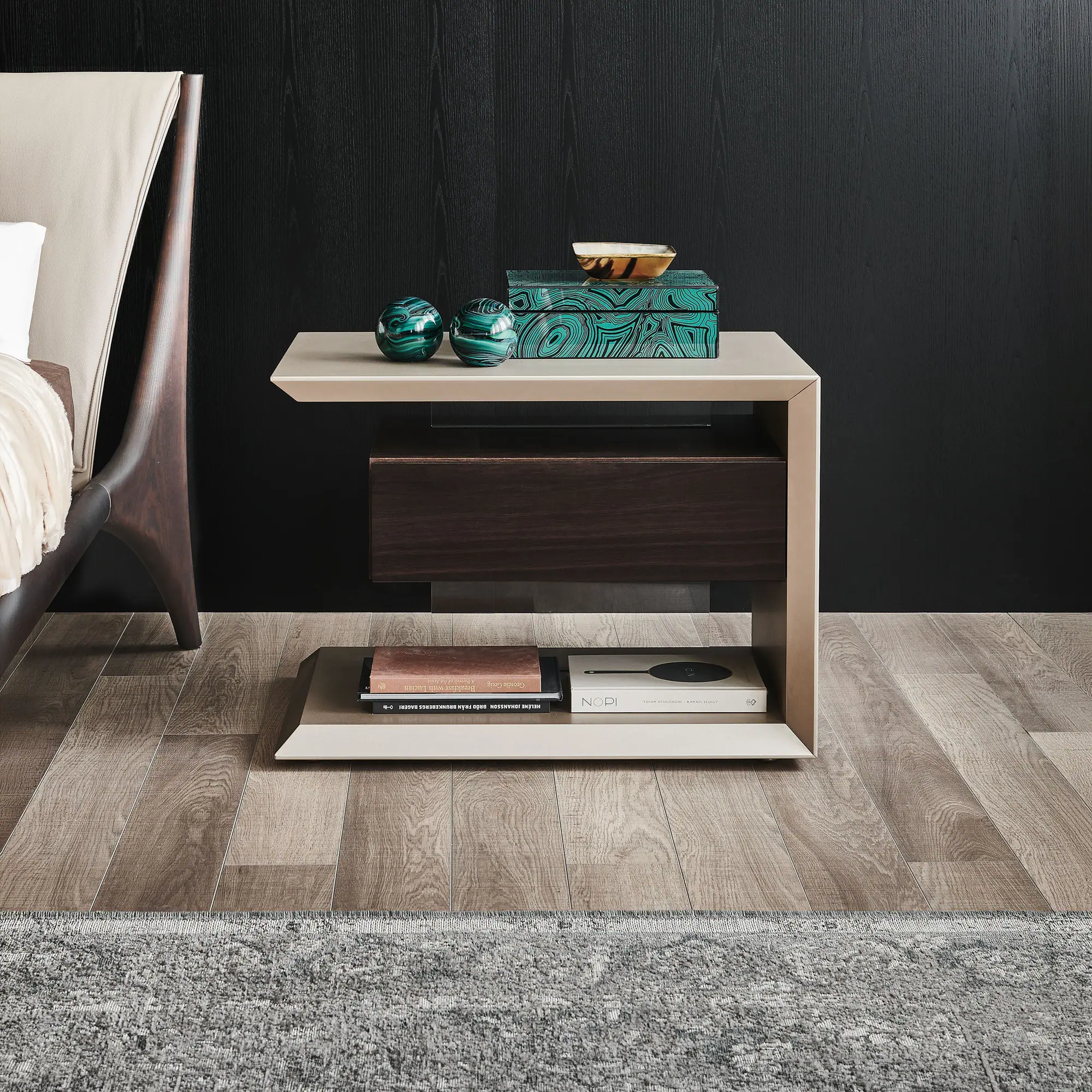 Contemporary nightstand with storage and decorative accents in a modern bedroom setting.