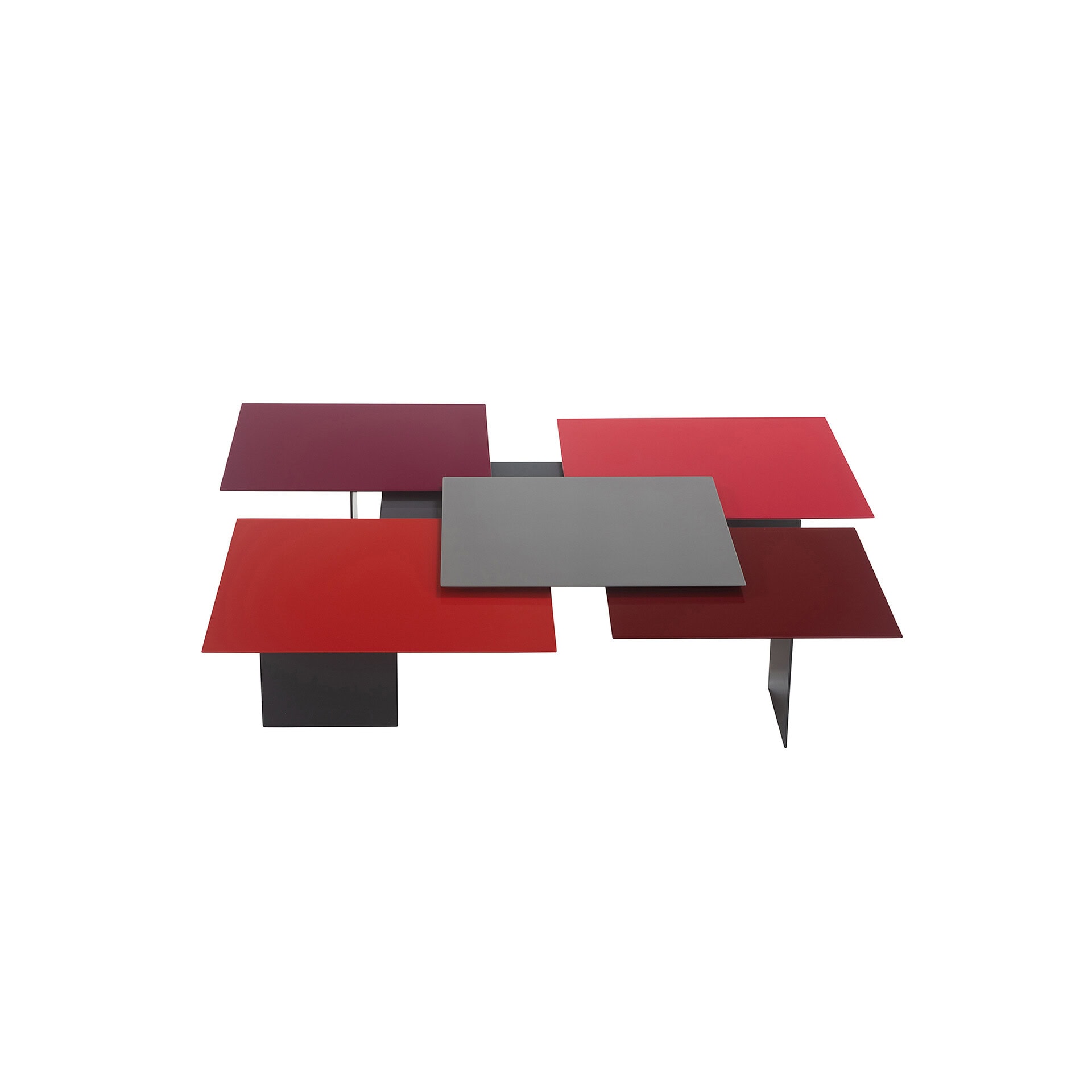 A modern coffee table with five overlapping rectangular panels in shades of red, burgundy, and gray, on a white background.