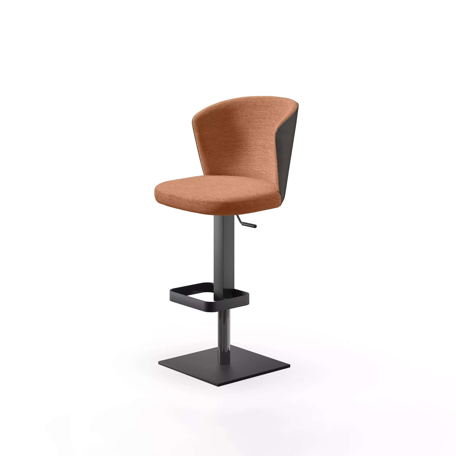 A modern bar stool with a terracotta-colored upholstered seat and backrest, a dark grey back, and a dark grey metal adjustable pedestal base with a square footrest, on a white background.