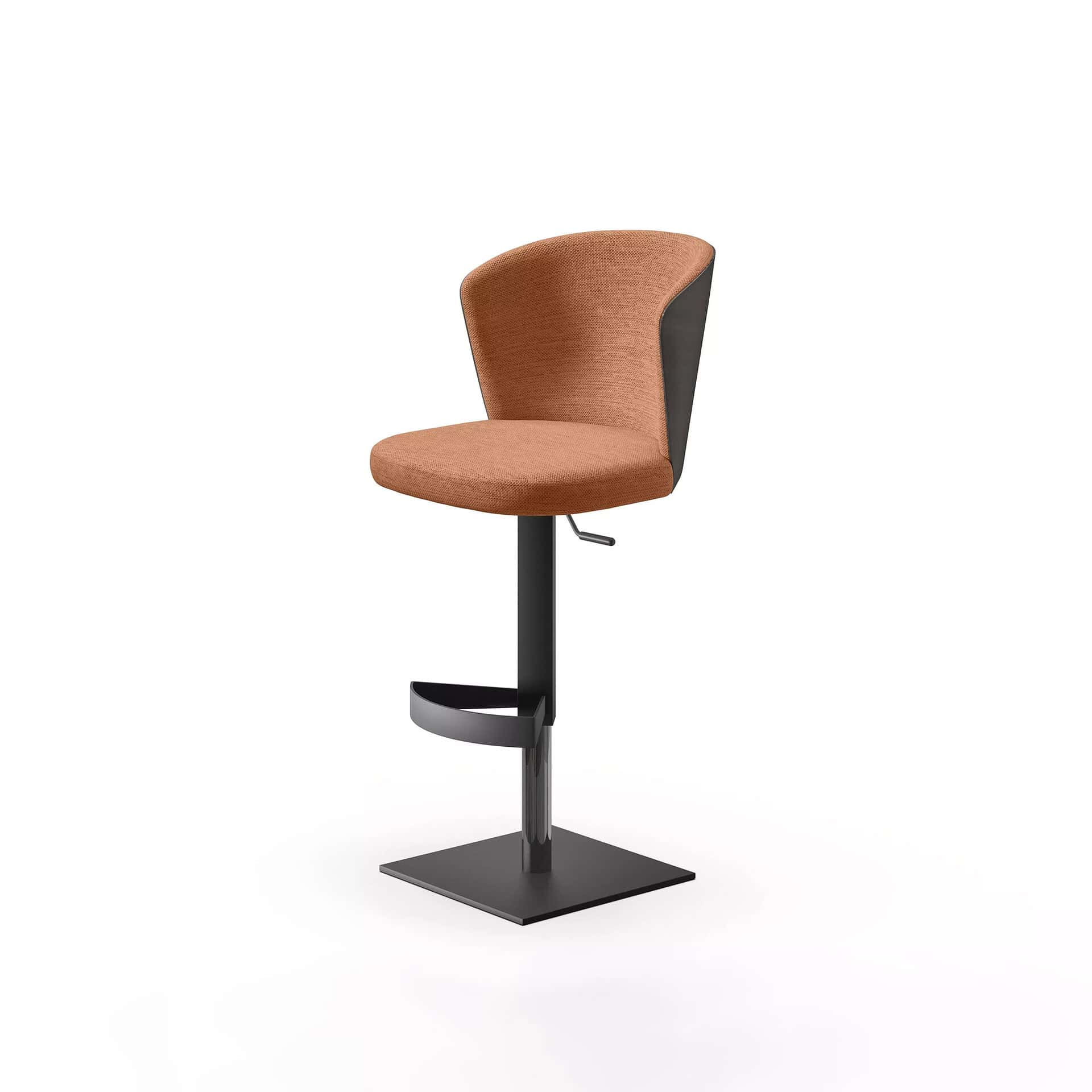 A modern bar stool with a terracotta-colored upholstered seat and backrest, a dark grey adjustable central pole, a semi-circular footrest, and a square base, against a white background.