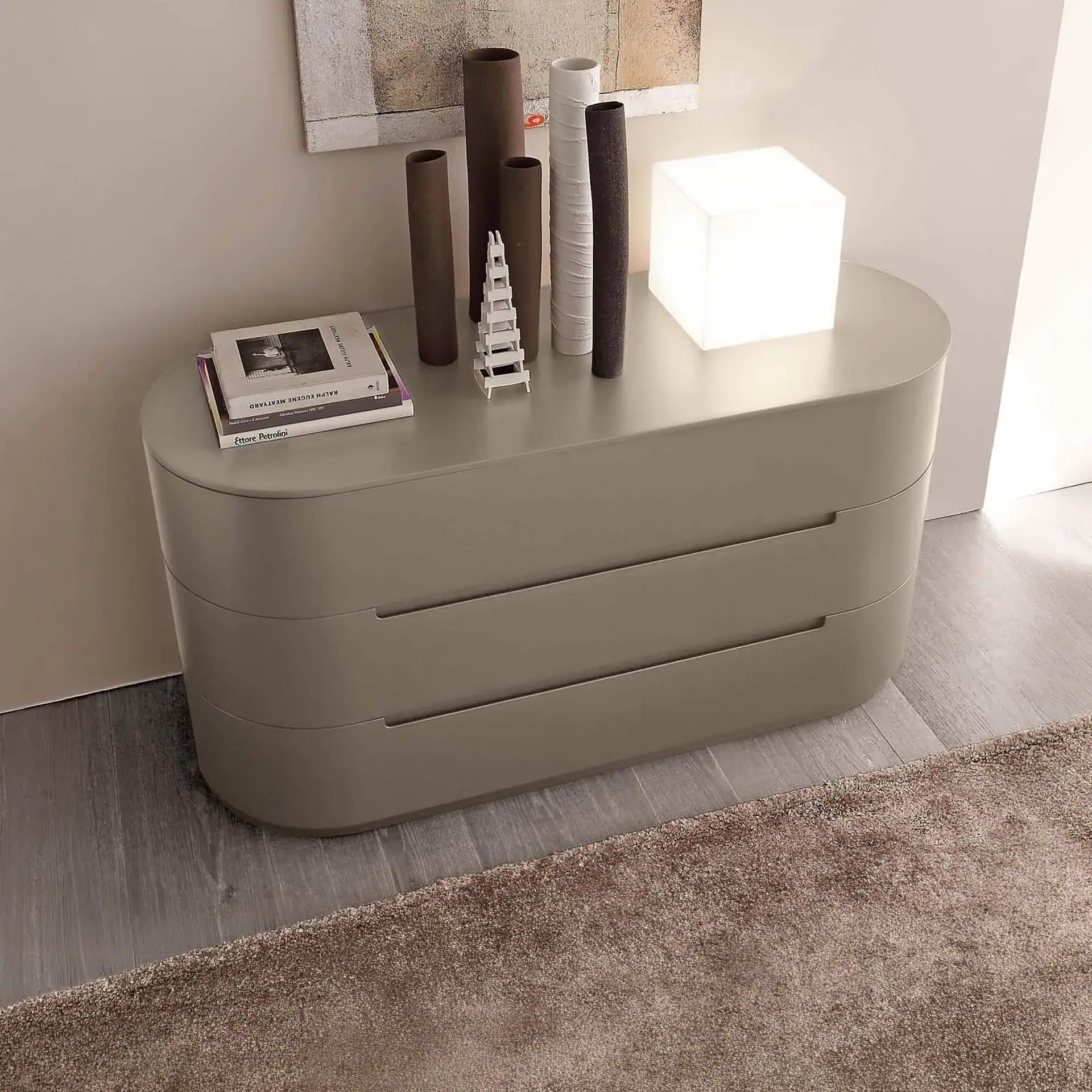 Globo 3-Drawer Dresser with decorative items on top.