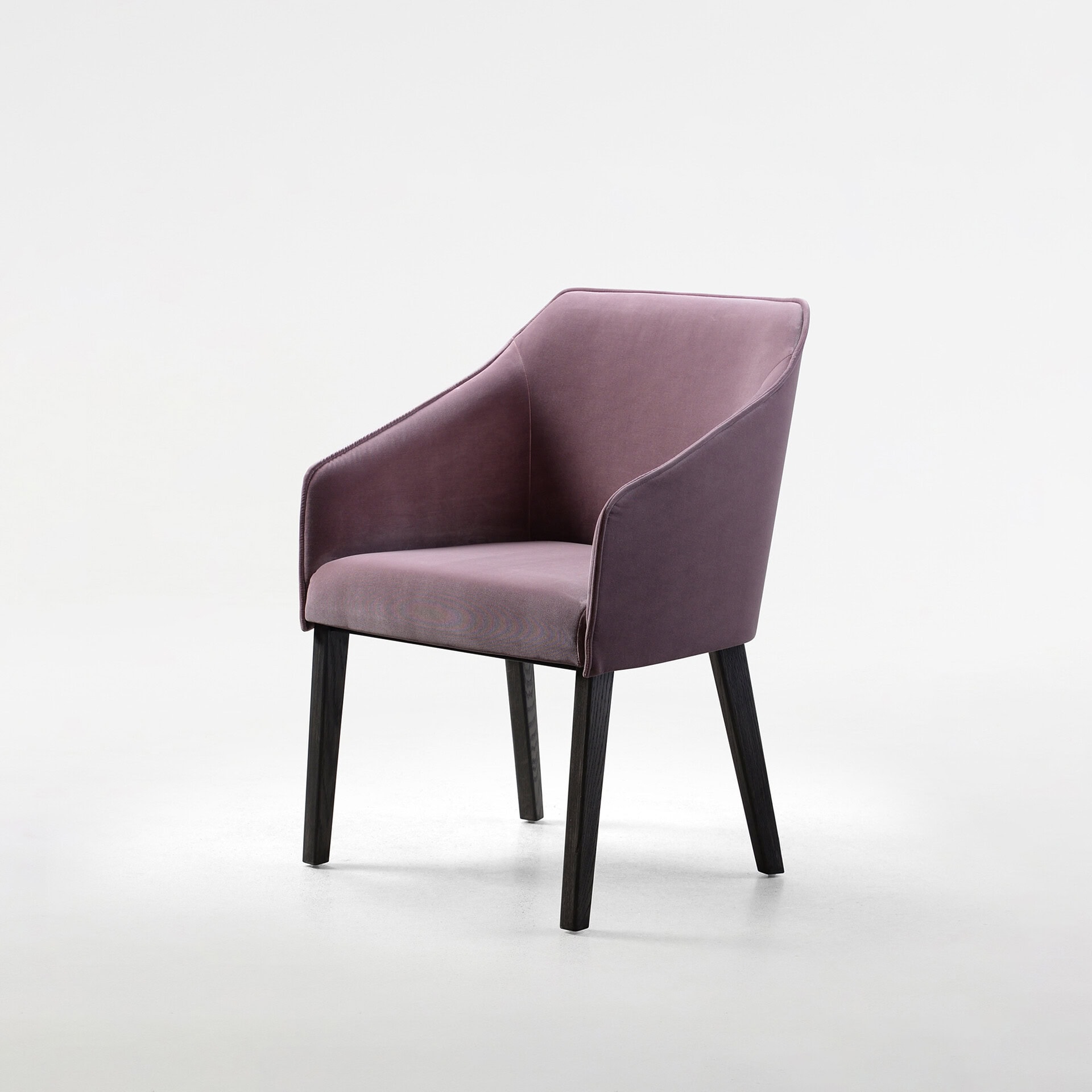 Elegant purple upholstered armchair with wooden legs, perfect for contemporary living spaces.