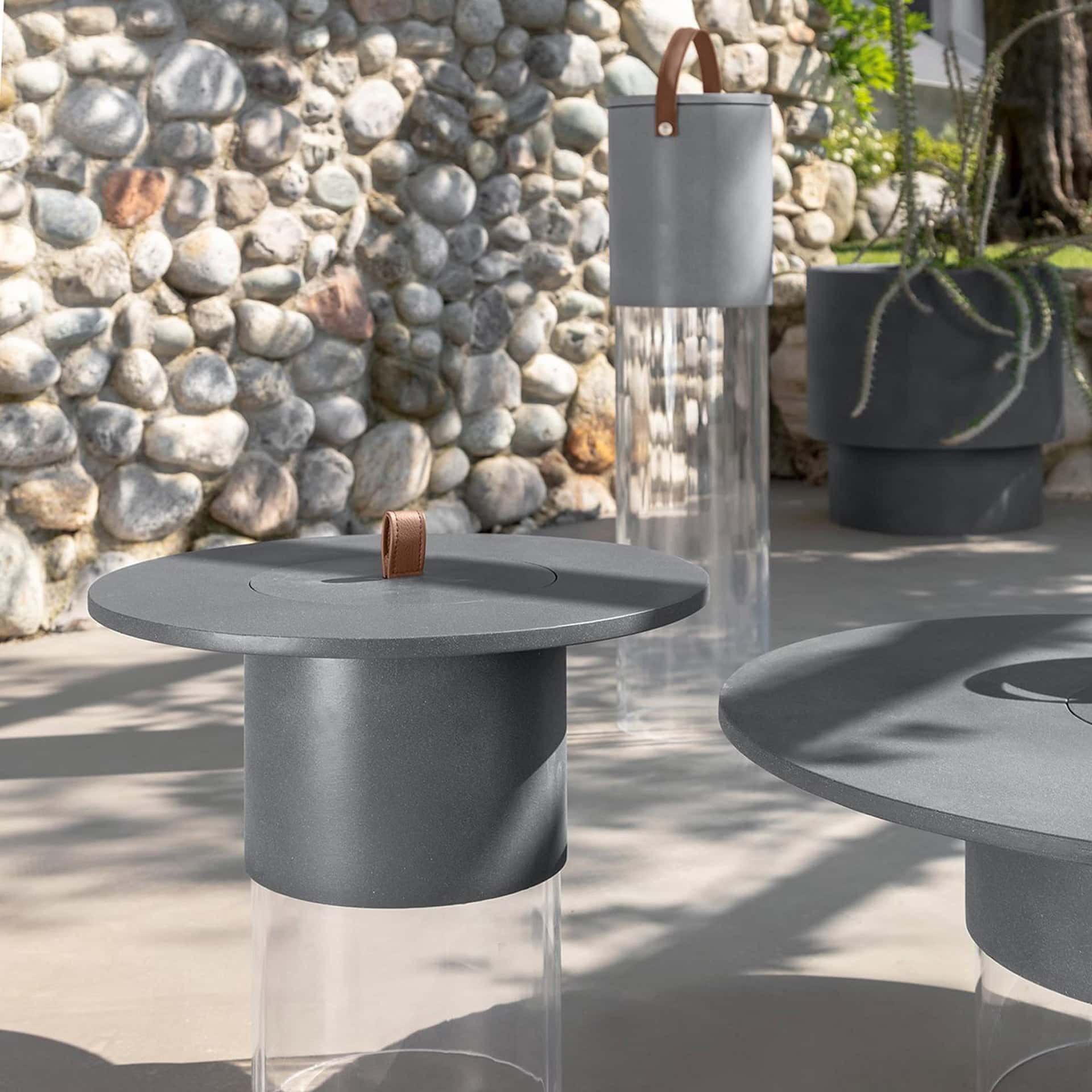 Stylish outdoor side table featuring a smooth surface and contemporary aesthetic.