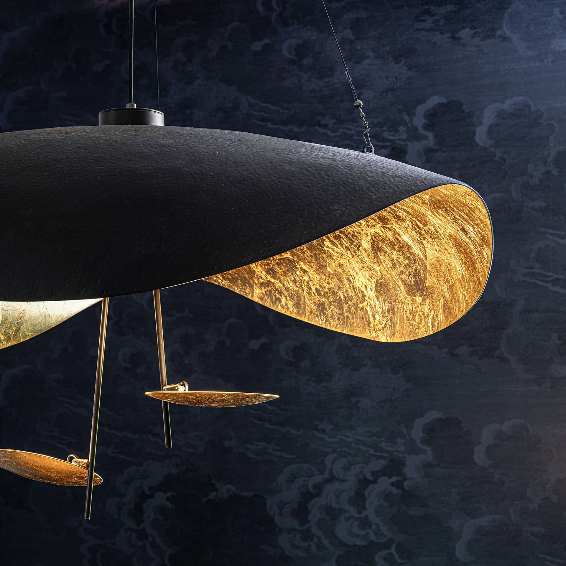 Elegant black and gold pendant lighting for contemporary home design.