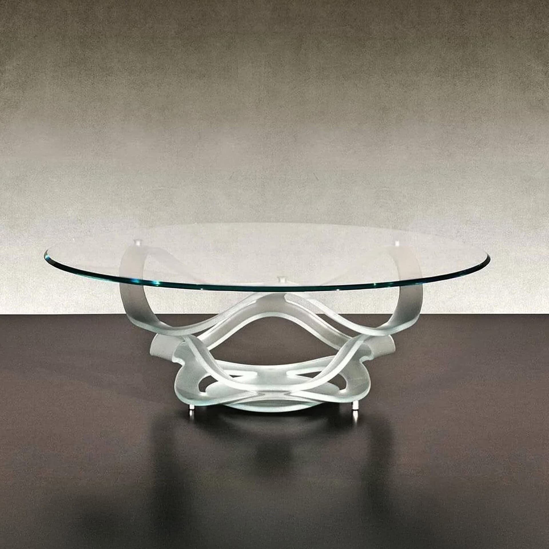 Neolitico 40 Glass Coffee Table with extra clear curved glass base and round beveled glass top in a modern living room setting.