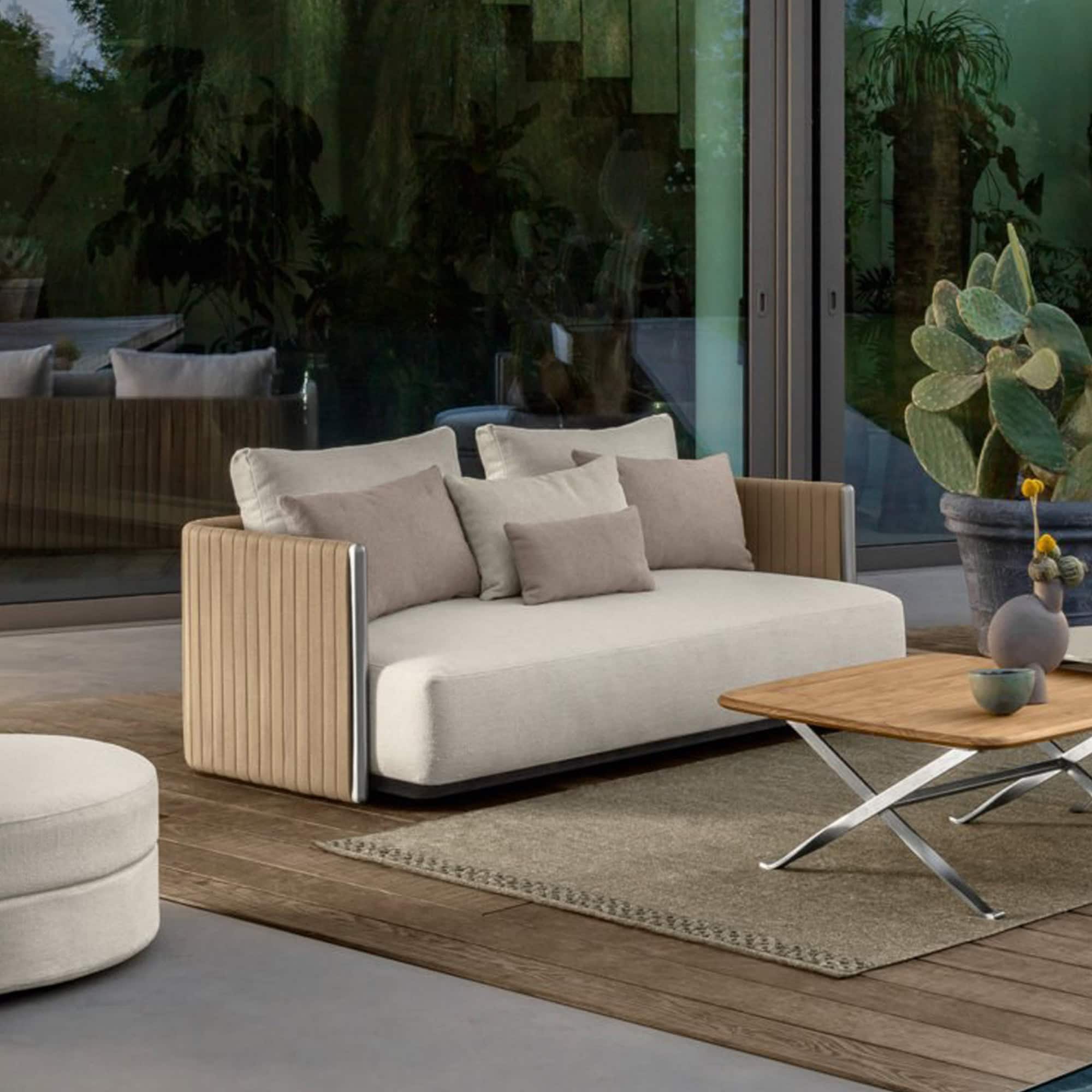 Elegant beige sofa with soft cushions, perfect for contemporary living spaces.