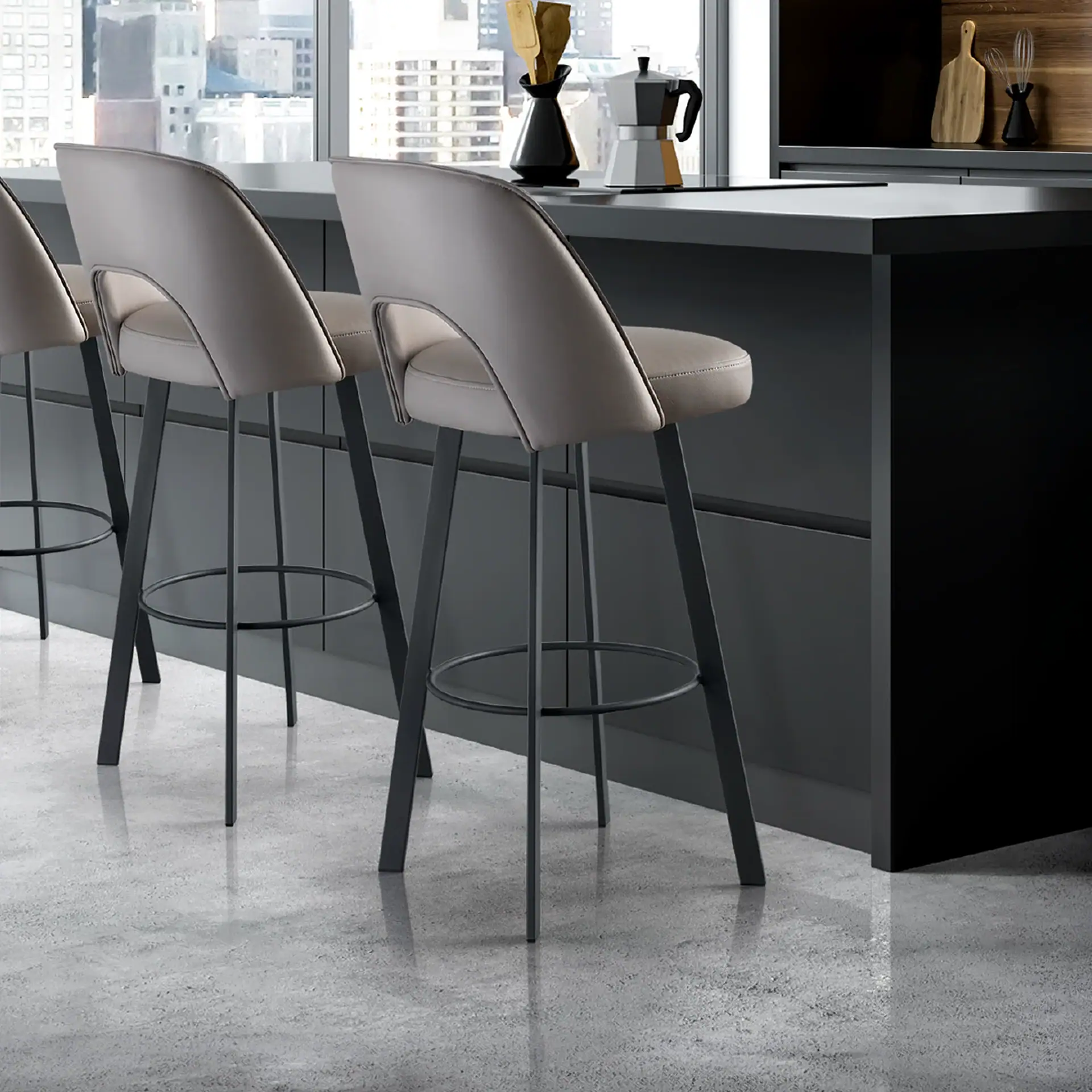 Mia upholstered bar and counter stools with beige seats and black legs at a kitchen island.