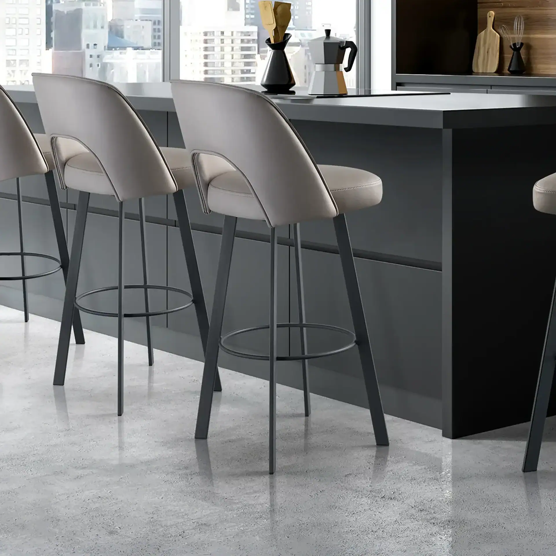 Mia upholstered bar and counter stools with beige seats and black legs at a kitchen island.