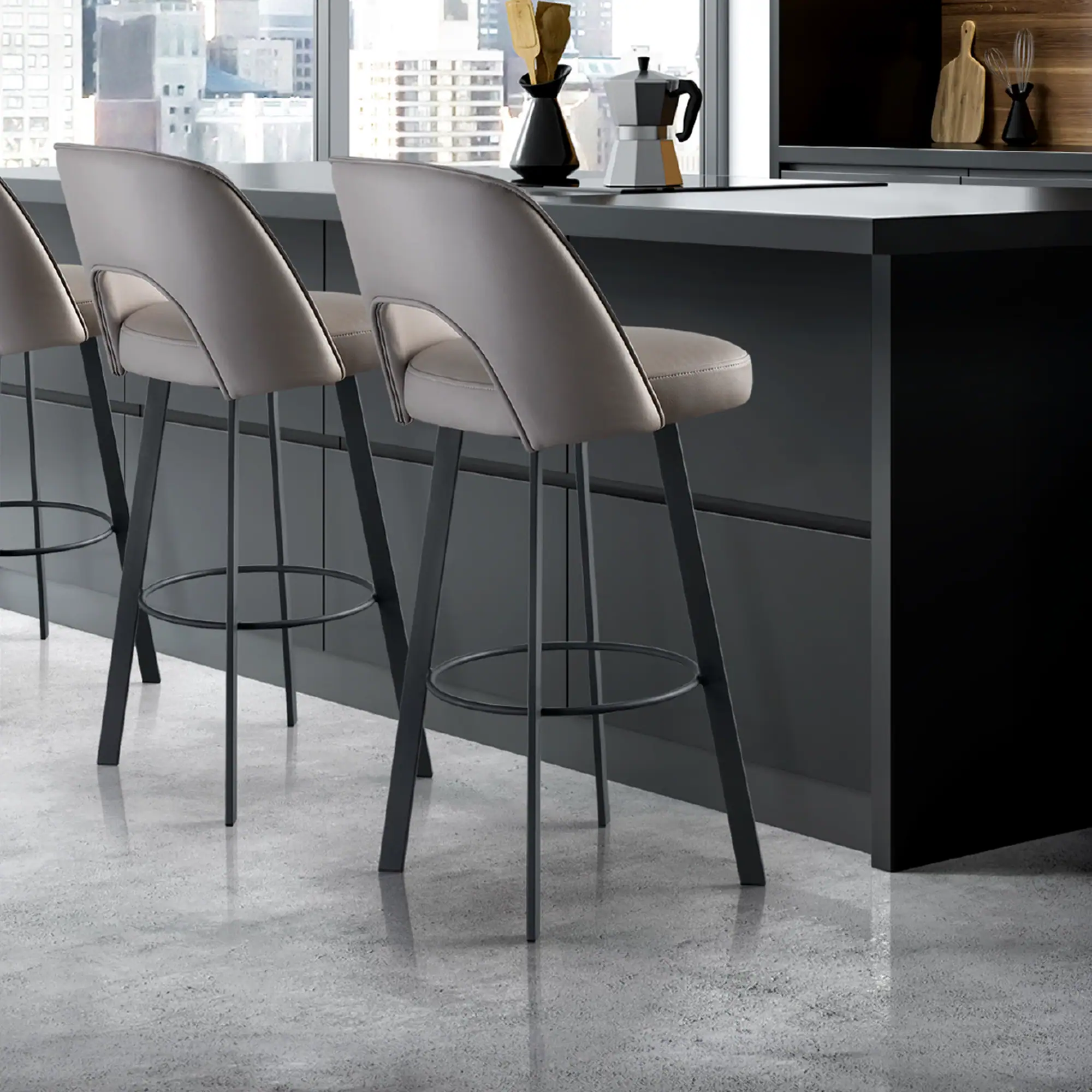 Mia upholstered bar and counter stools with beige seats and black legs at a kitchen island.