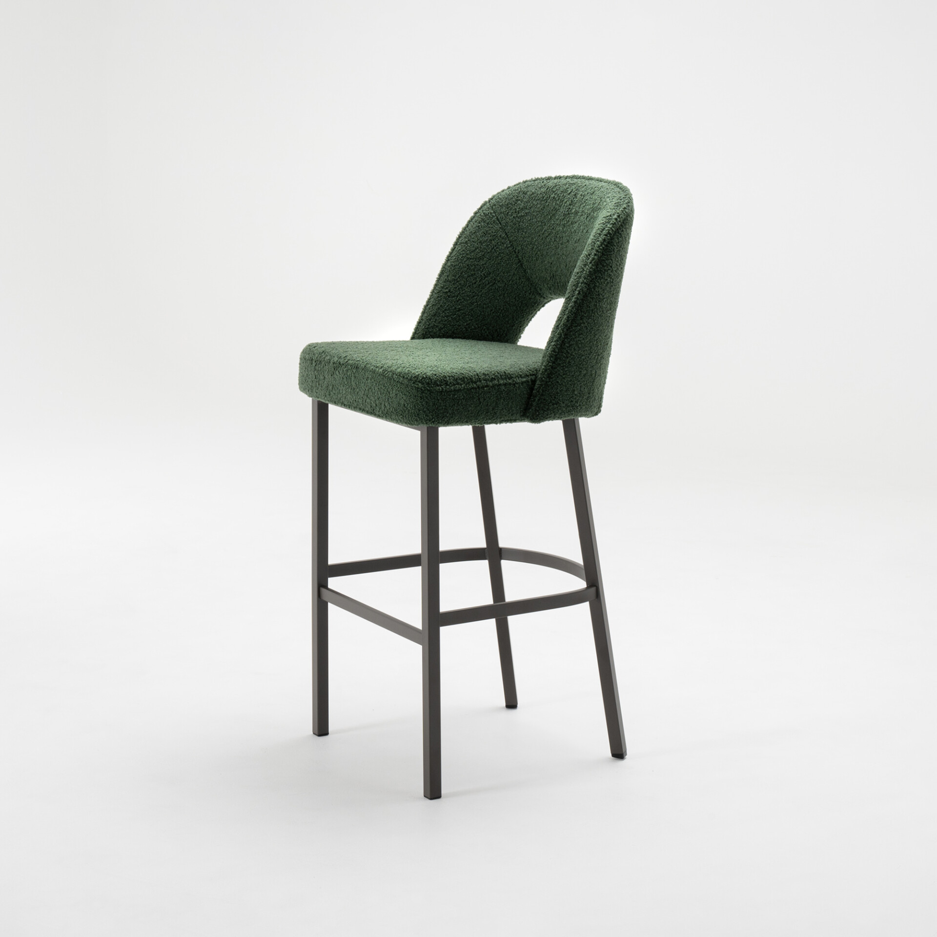 A modern bar stool with deep forest green bouclé upholstery and a dark gray metal frame, set against a white background.