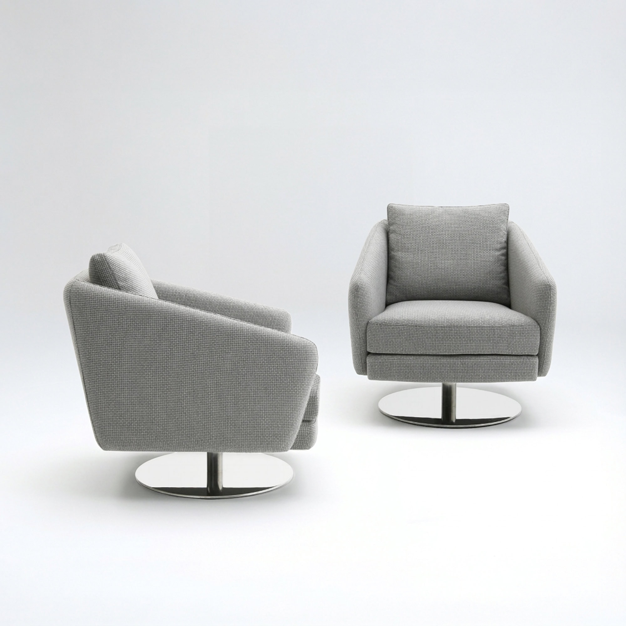 A modern, light grey upholstered swivel armchair with a polished chrome base, centered on a white background.