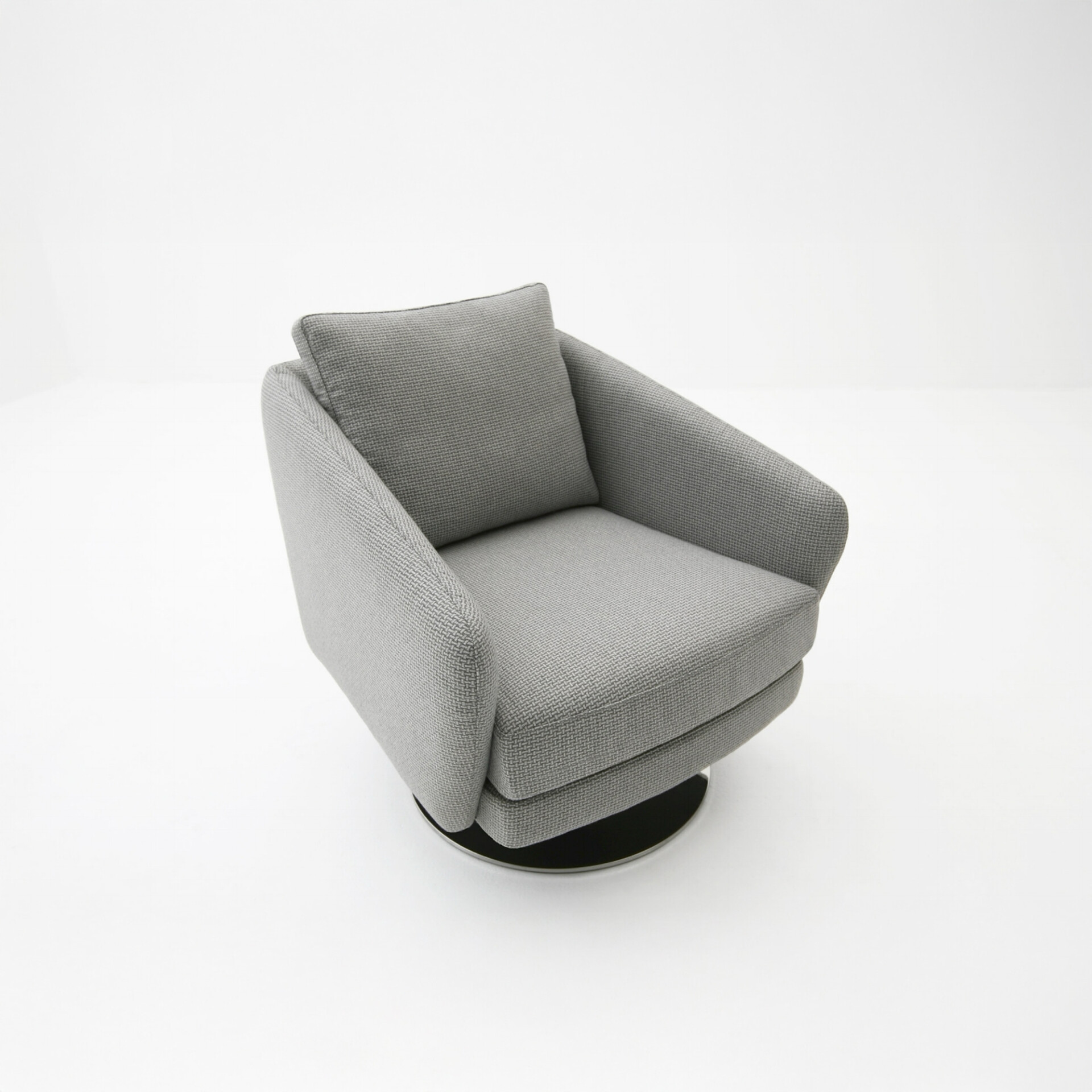 A modern light gray upholstered armchair with a woven texture and a black round swivel base, set against a white background.