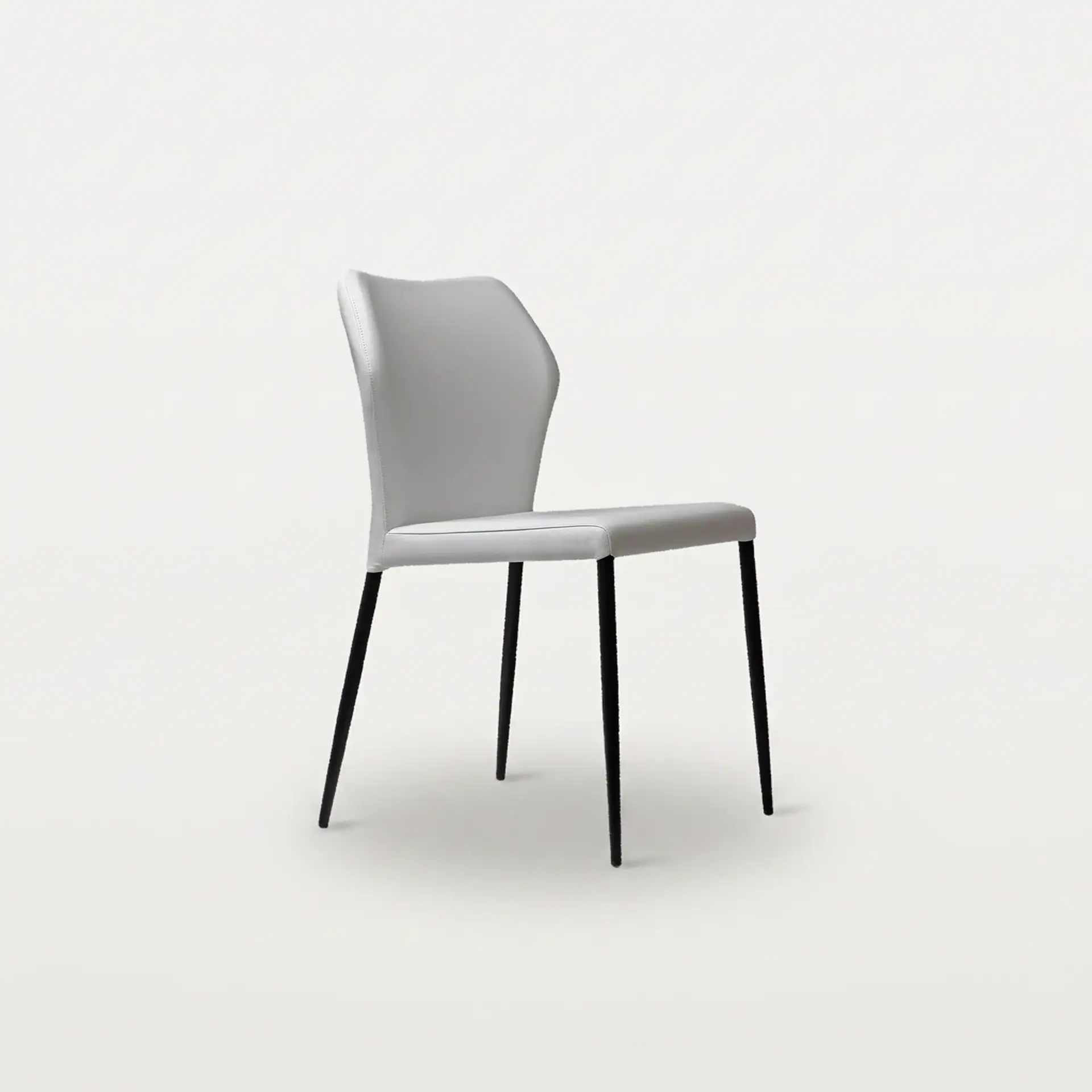 Elegant angle dining chair with upholstered seat and backrest, black metal legs.